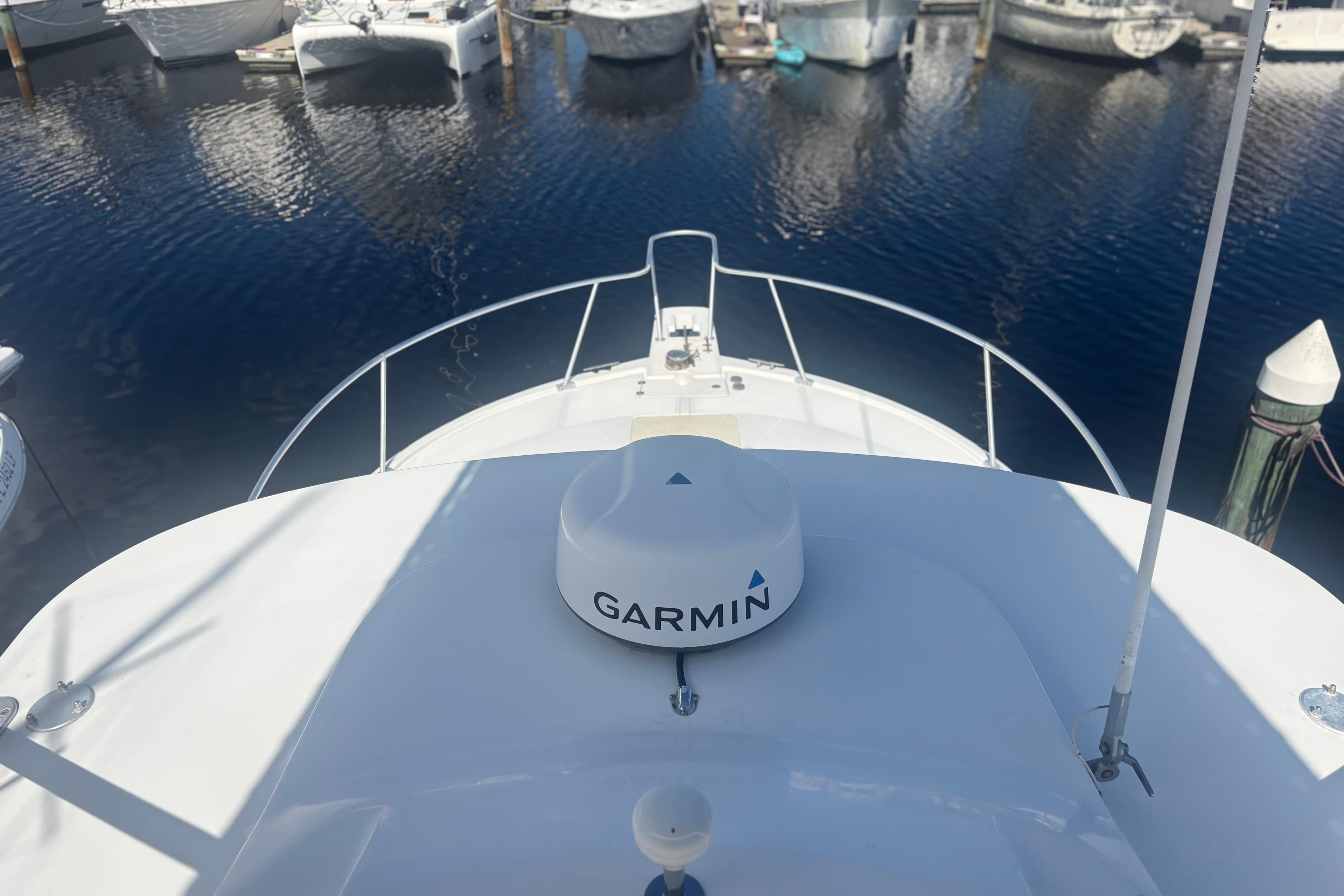 2004 Luhrs 32 Open boat with Garmin equipment, docked in a marina.