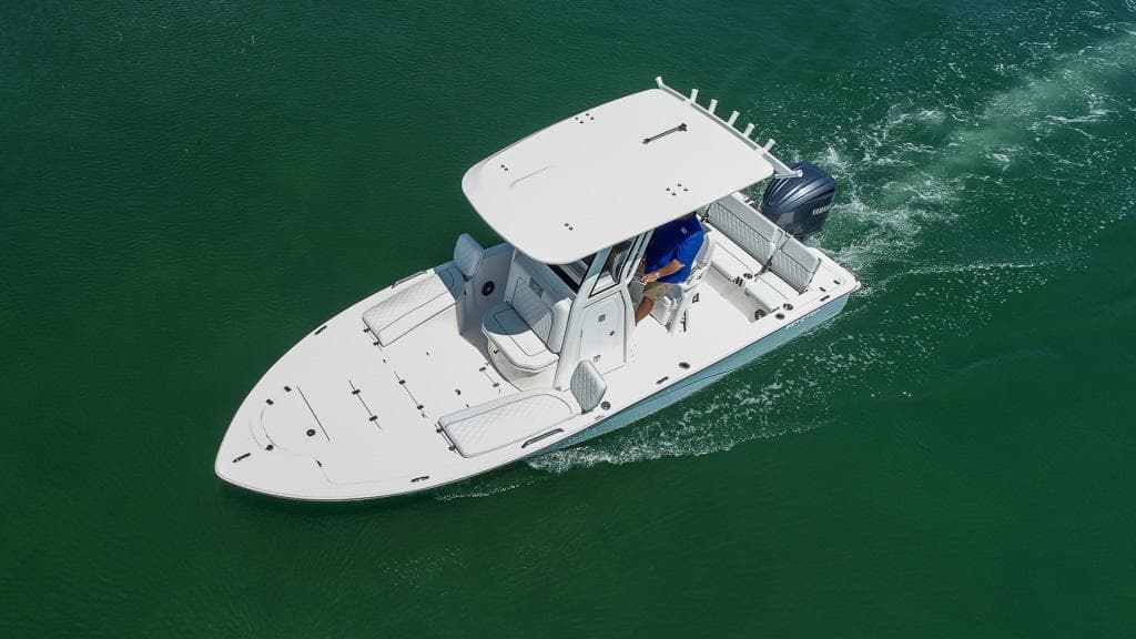 2025 Sea Fox 231 Bay Fox boat cruising on green water.