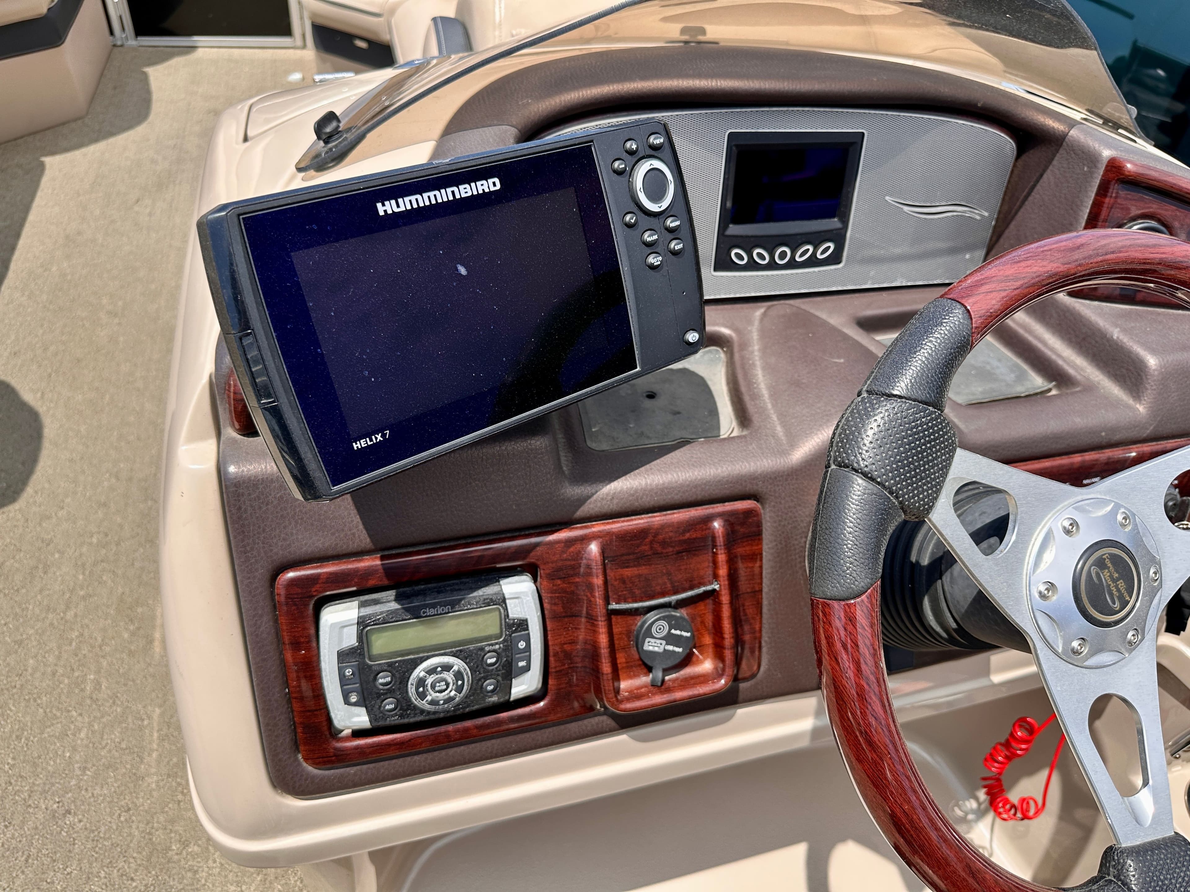 Dashboard of a 2015 South Bay 522 CR with Humminbird Helix 7.