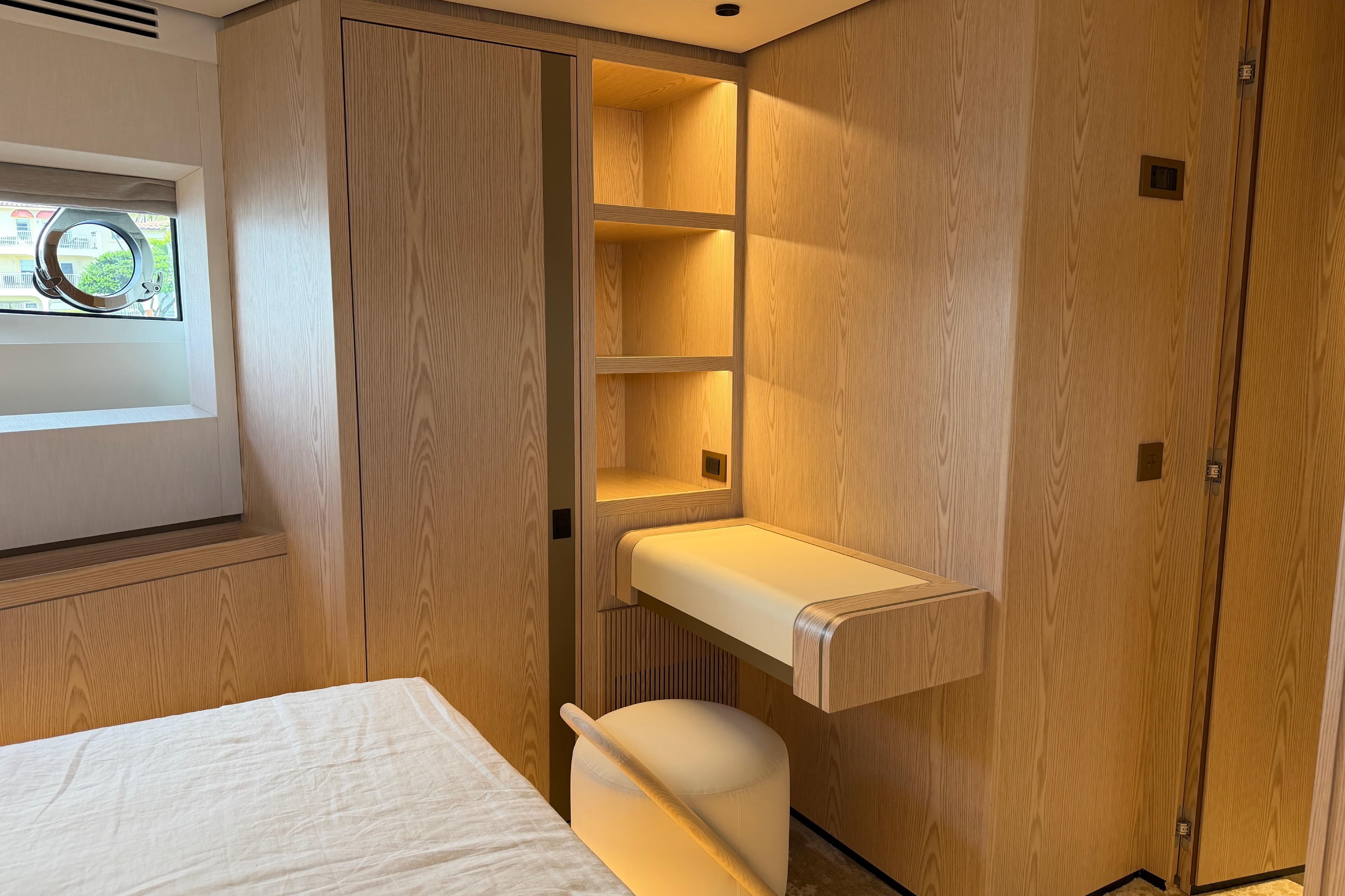 Luxurious interior of 2028 Solaris Power 70 Long Range yacht with elegant wood finishes.