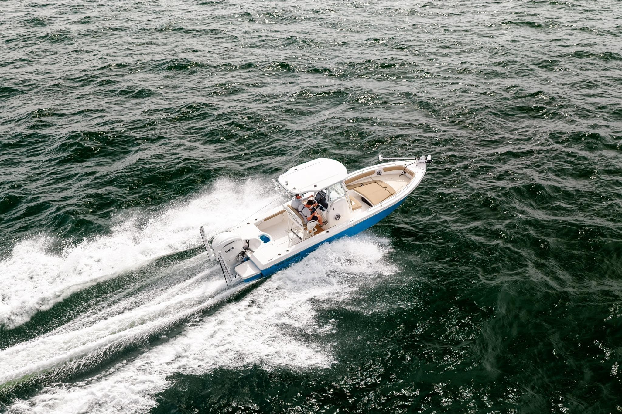 2023 Everglades 243 Center Console boat cruising on open water.