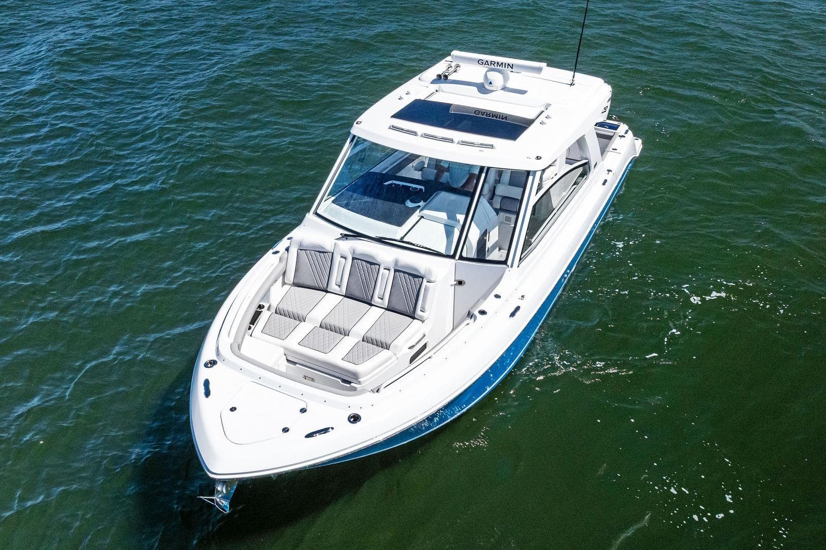 Manufacturer Provided Image: 2025 Everglades 367 CX boat cruising on open water, aerial view.