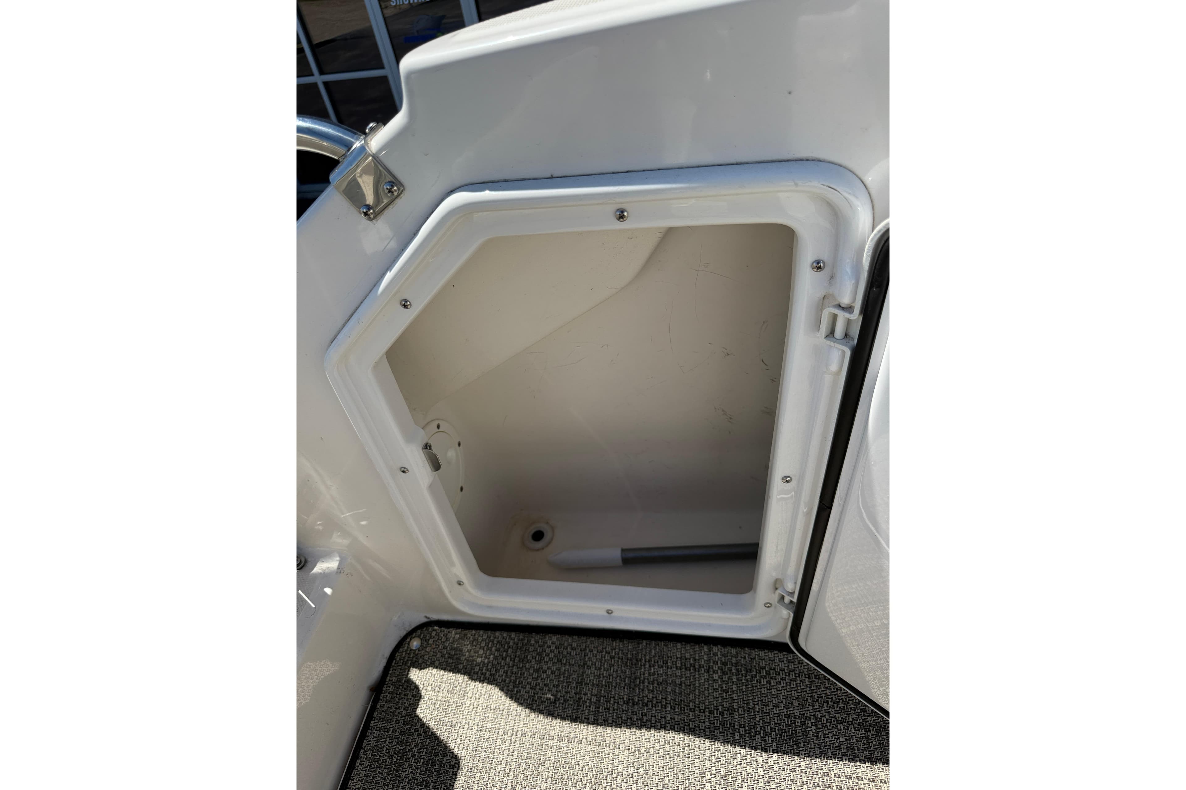 Open storage compartment on a 2005 Regal Commodore 2665 boat.