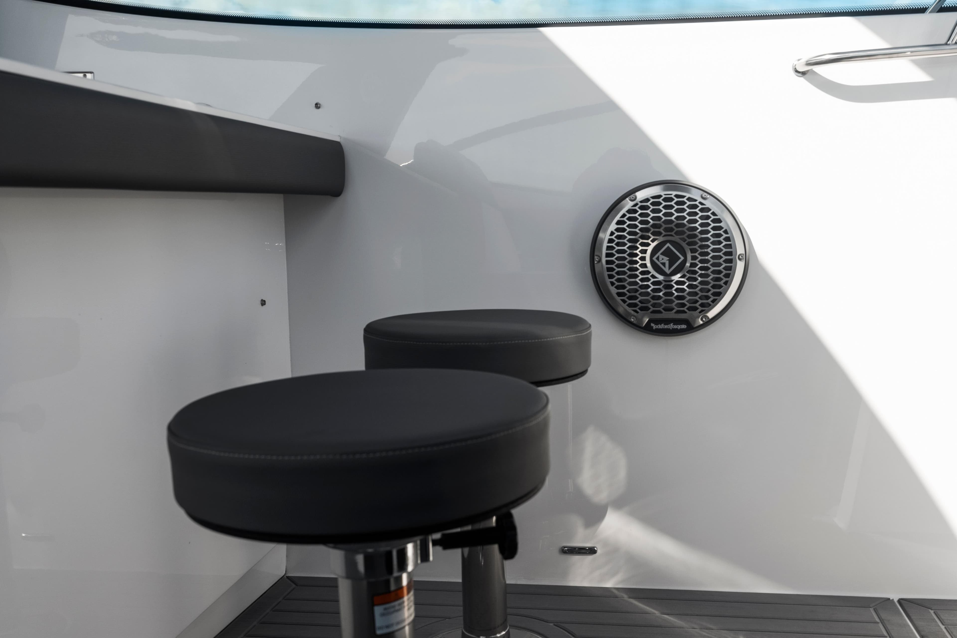 2026 Cruisers Yachts 38 GLS OB interior with bar stools and speaker.