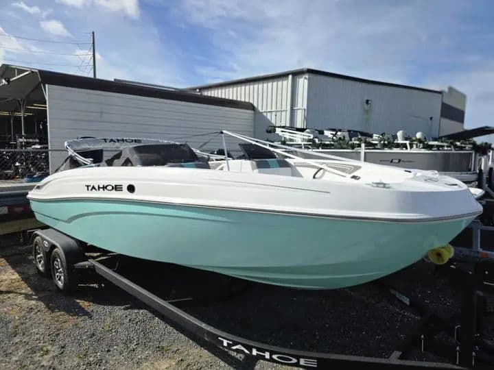 2026 Tahoe T21 boat on trailer in front of warehouse.