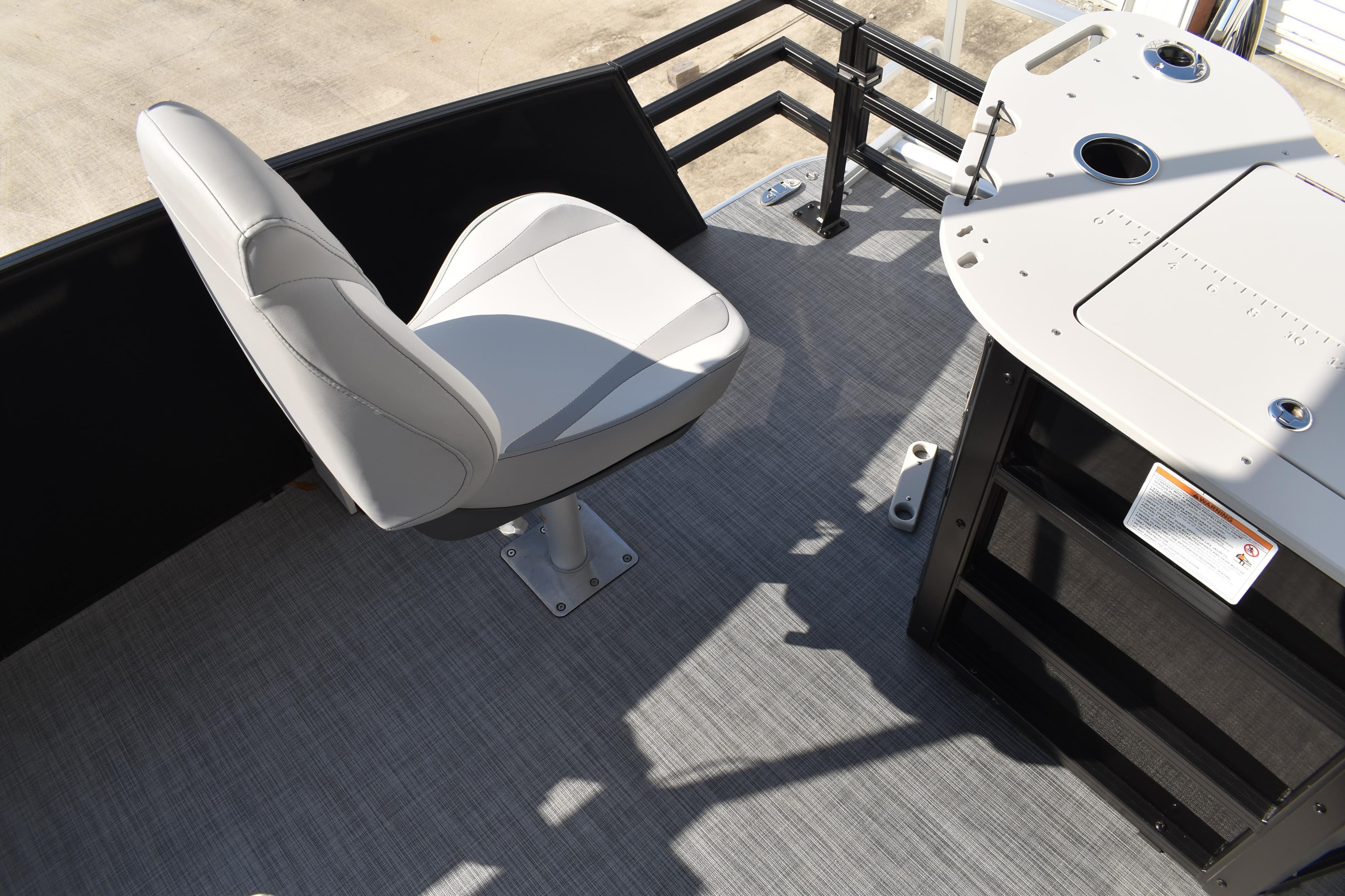 2026 Lowe SF 232 Sport Fish boat interior with fishing chair and console.