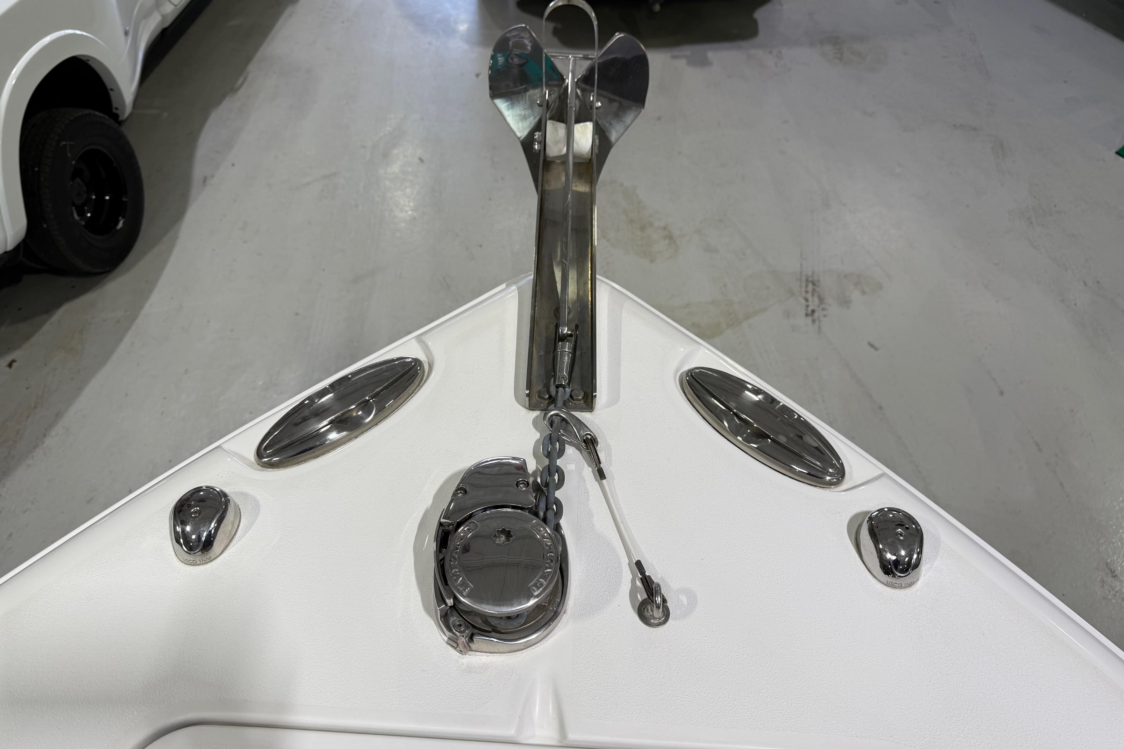 2016 Sea Hunt Gamefish 25 boat anchor and deck fittings in a showroom.