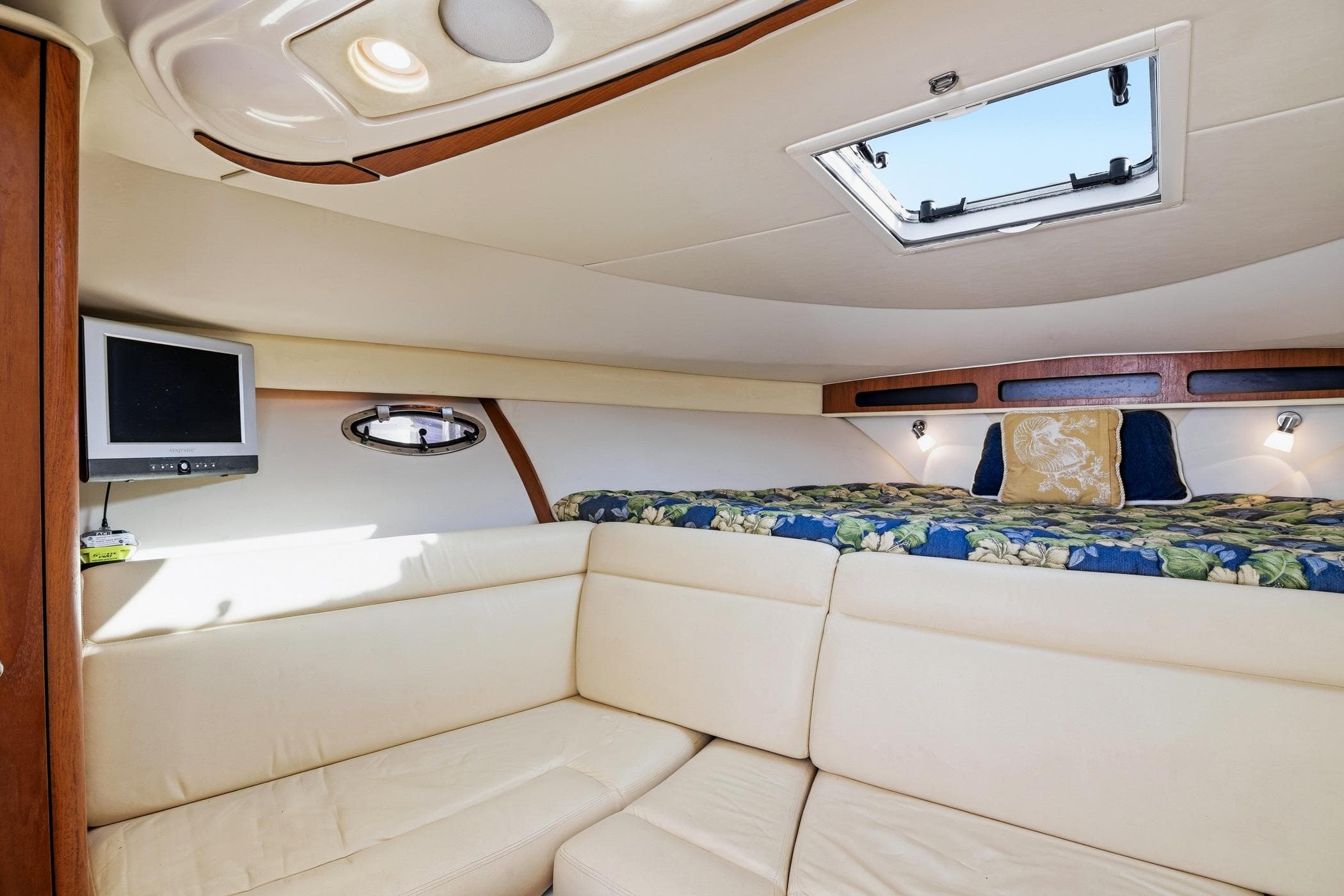 Luxurious interior of 2007 Tiara Yachts 3000 Open with cozy seating and elegant decor.