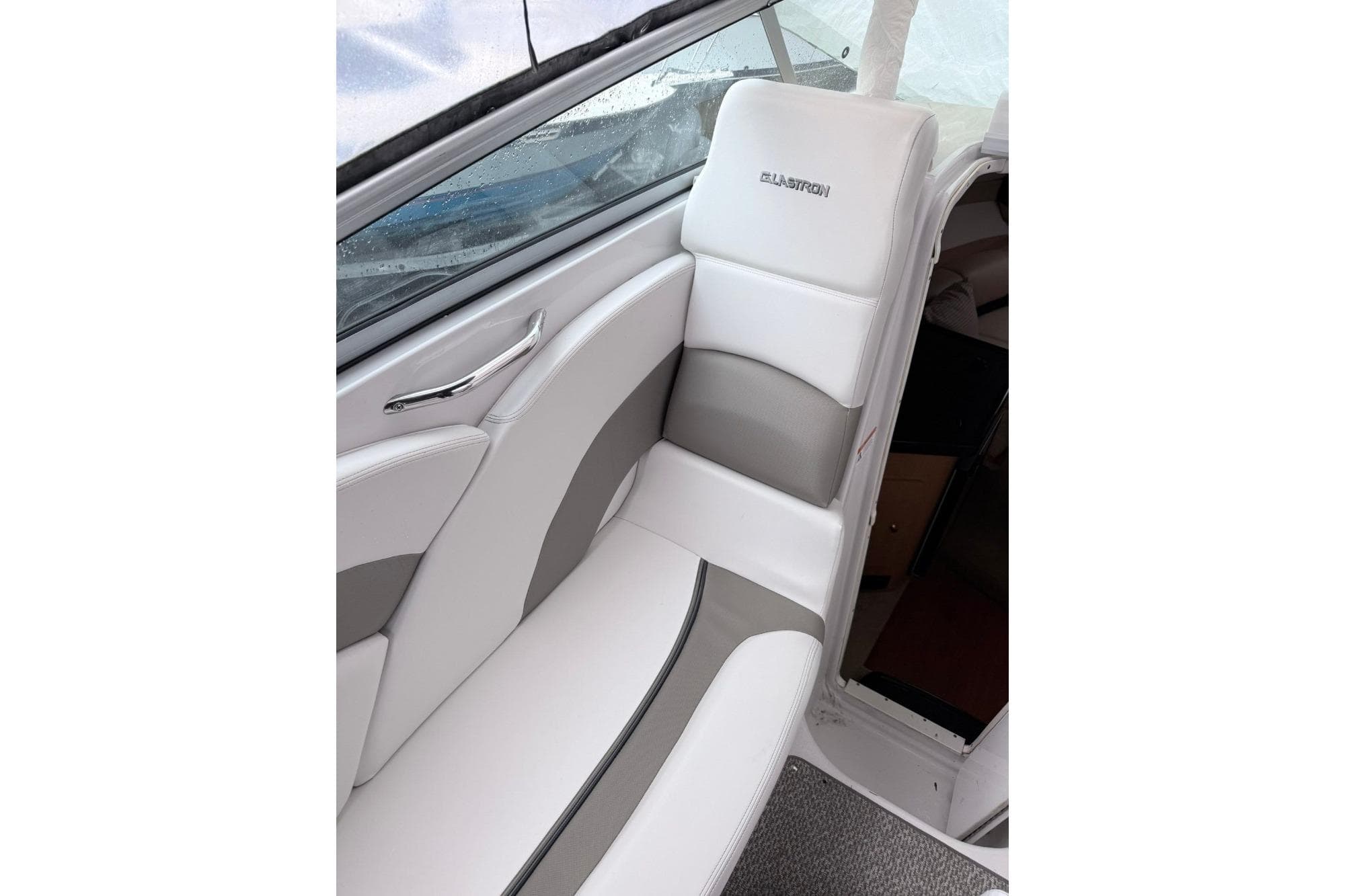 2014 Glastron/Carlson GS 259 boat interior with white and gray seating.
