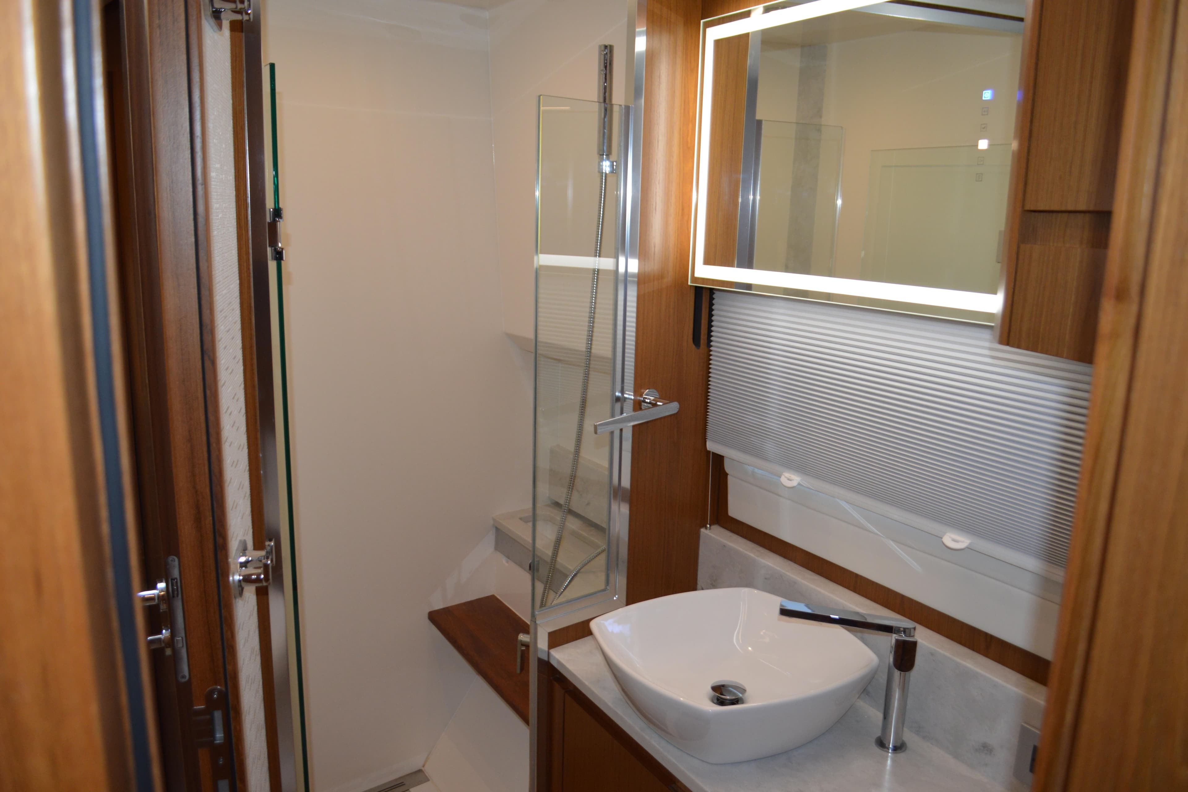 Luxurious bathroom interior of 2024 Tiara Yachts EX 60 with modern fixtures and elegant design.
