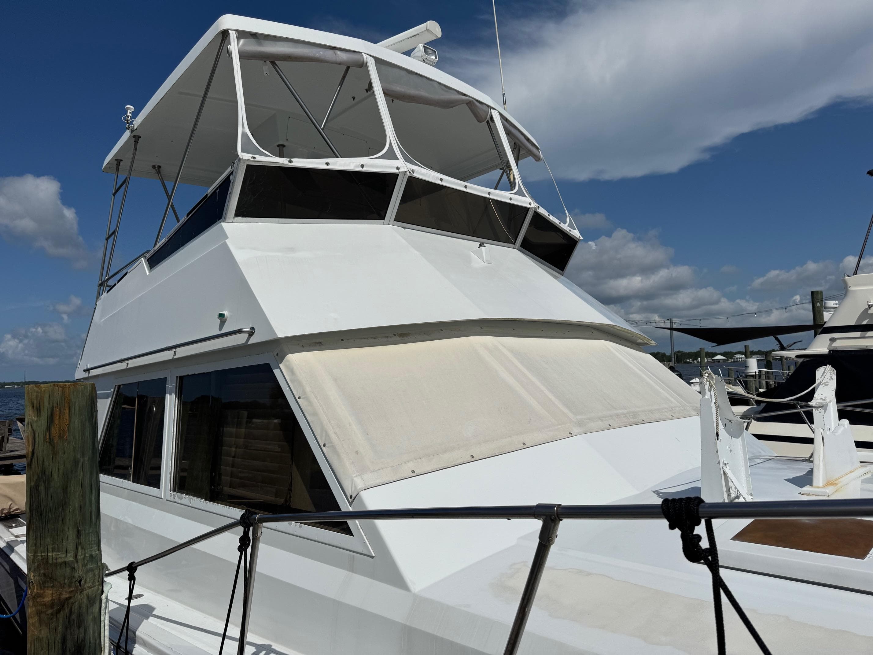 1982 Viking 46 Convertible yacht docked under a clear blue sky.