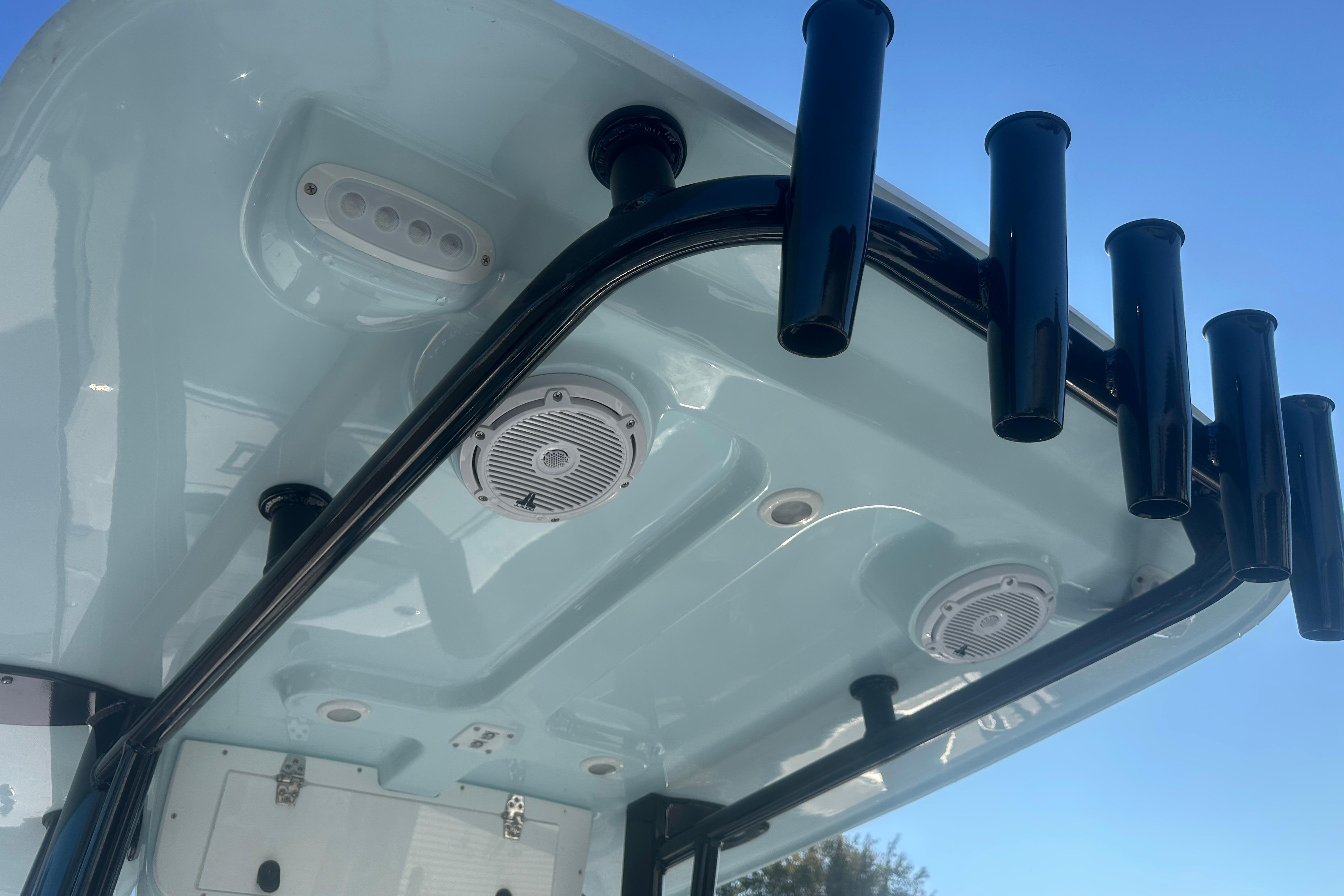 2026 Delta Boatworks Delta D245 T-top with rod holders and speakers.