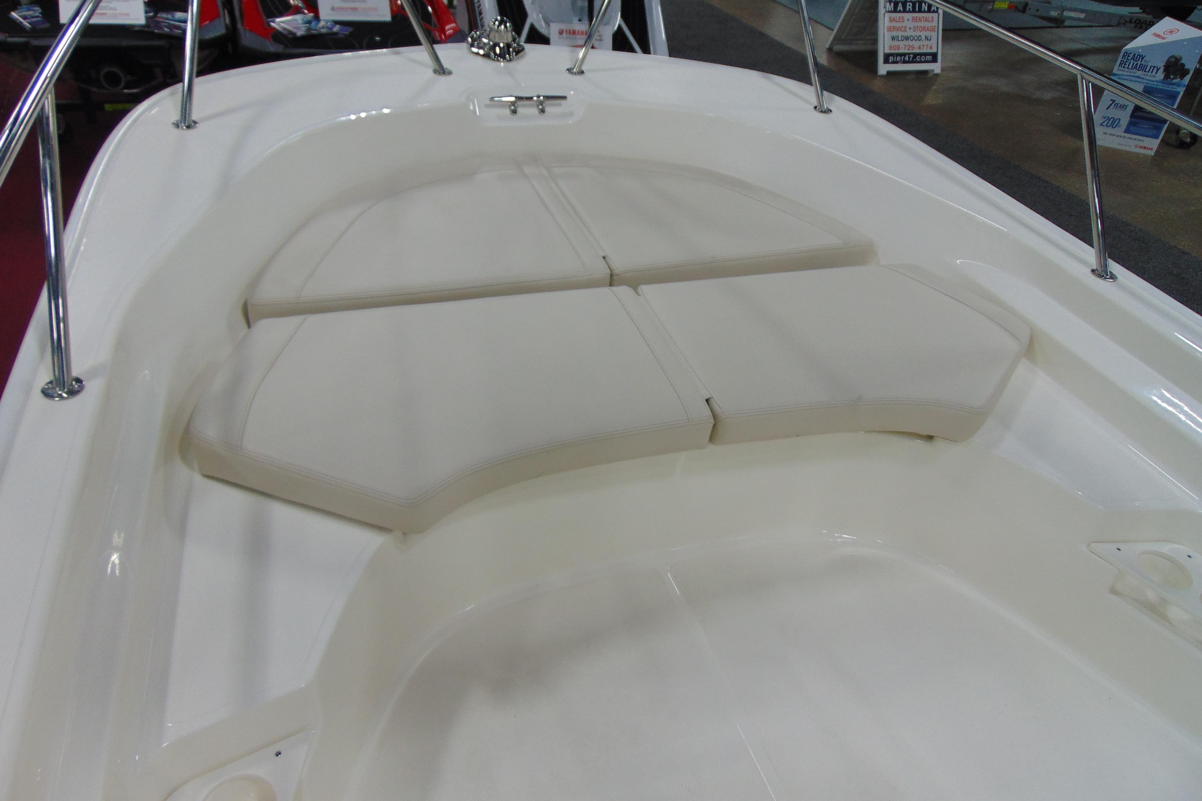 2026 Boston Whaler 170 Montauk boat interior with cushioned seating area.