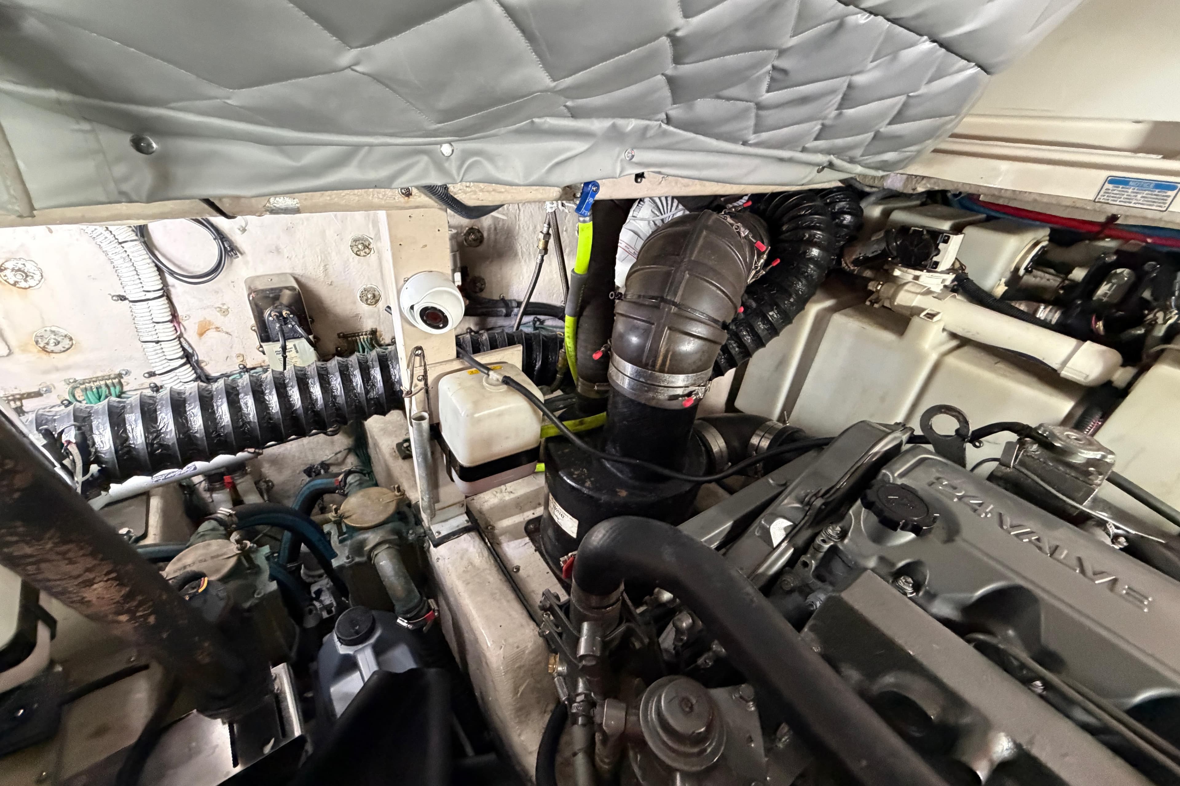 Engine compartment of a 2005 Sea Ray 360 Sundancer boat, showcasing mechanical components.