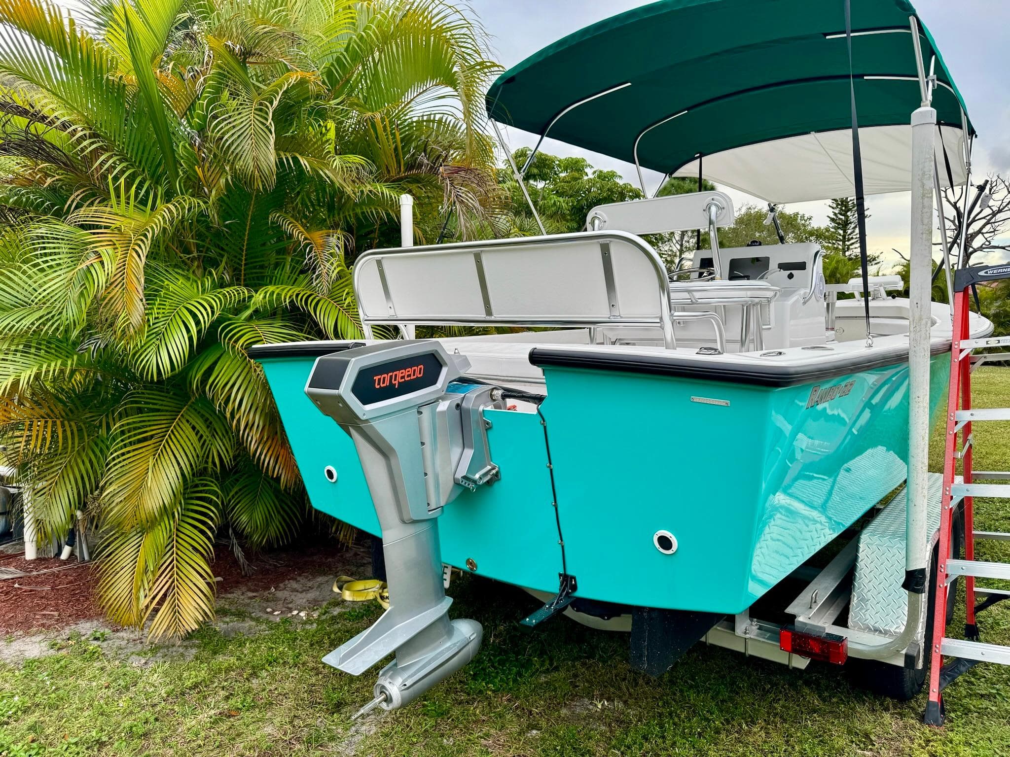 2024 Rambo 22 Center Console boat with Torqeedo motor on trailer.