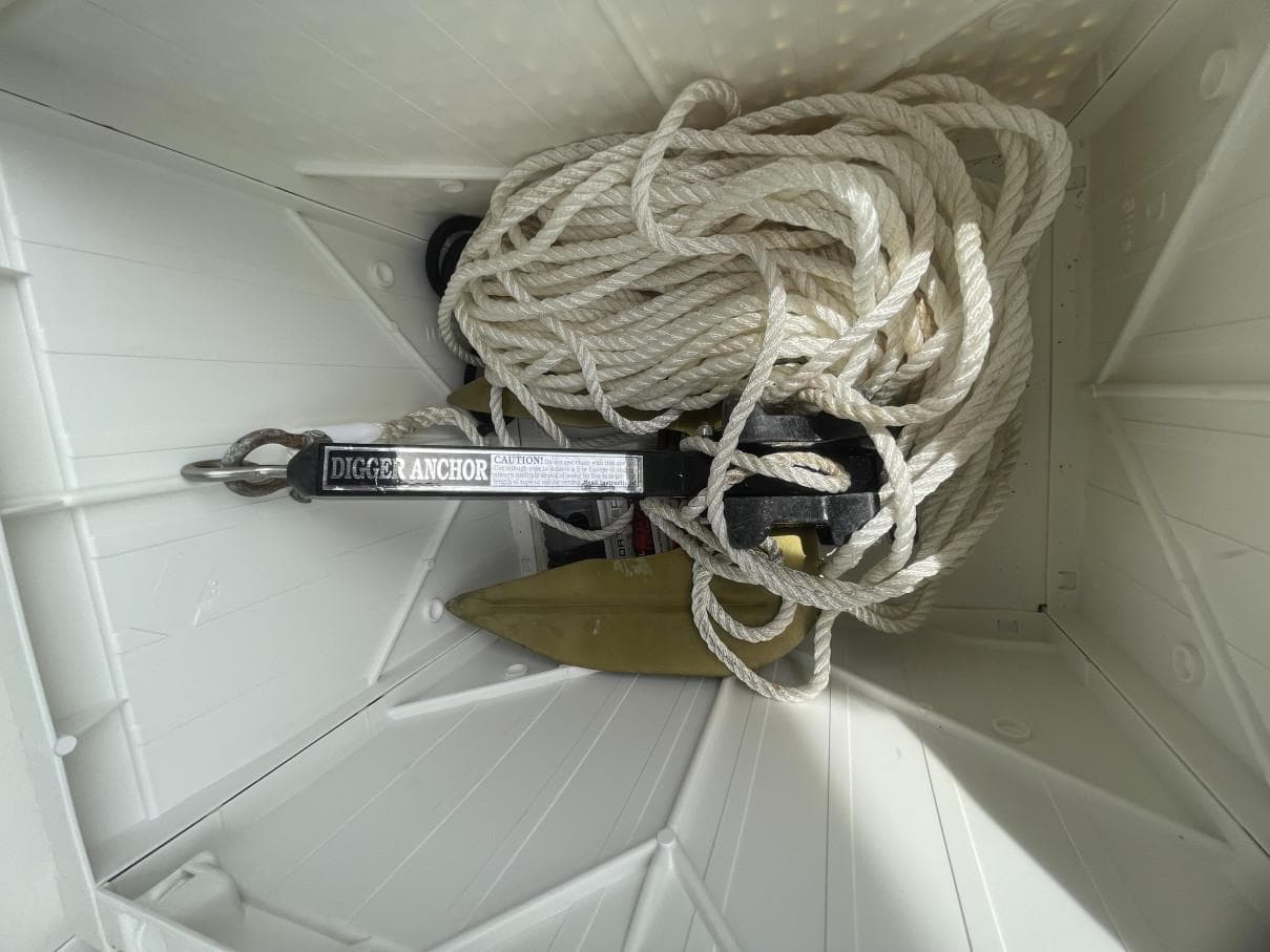 Anchor and rope stored in Sun Tracker PARTY BARGE, 1988 model.