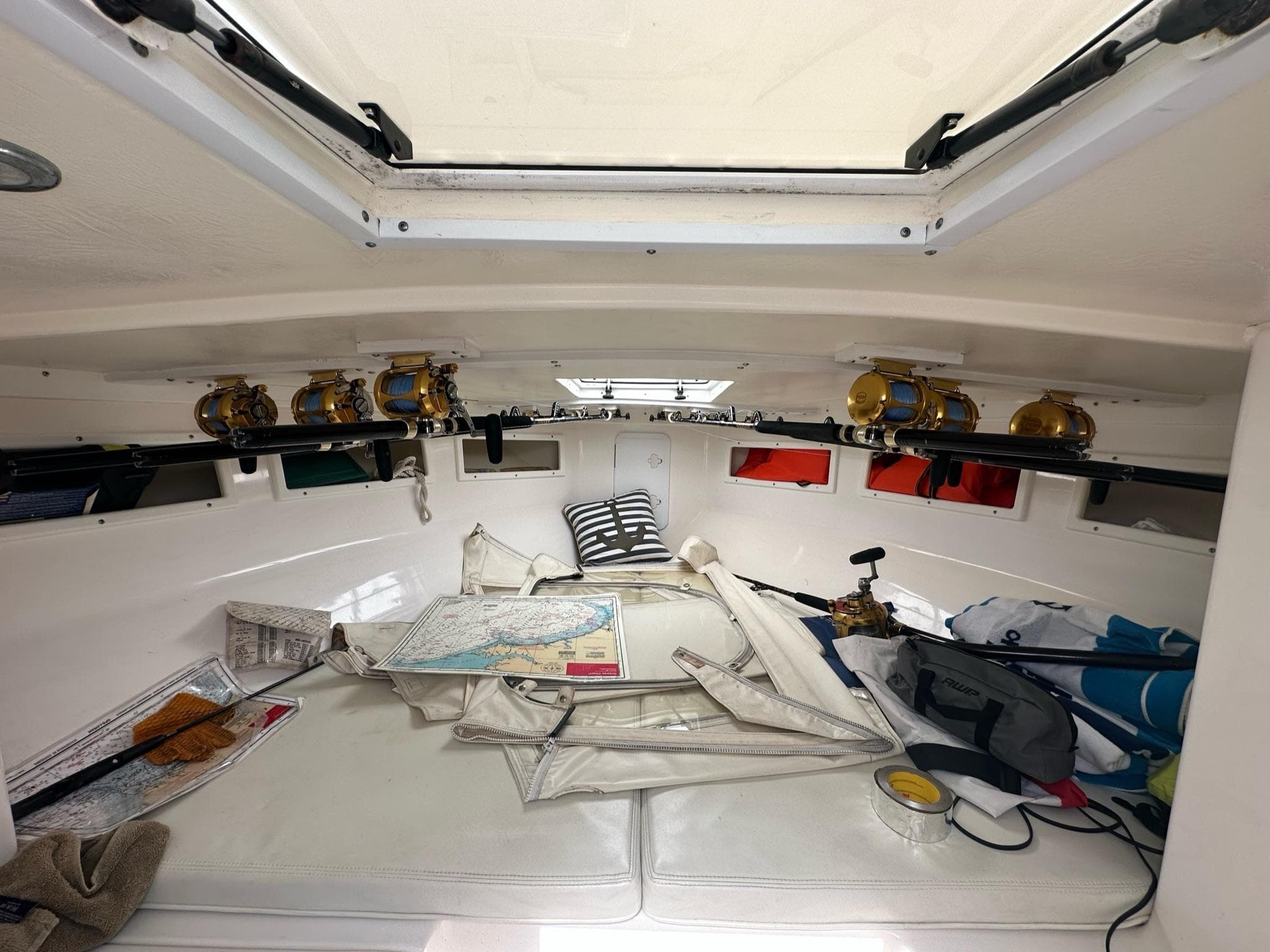 Interior of a 2016 Strike 35 boat with nautical equipment and maps.