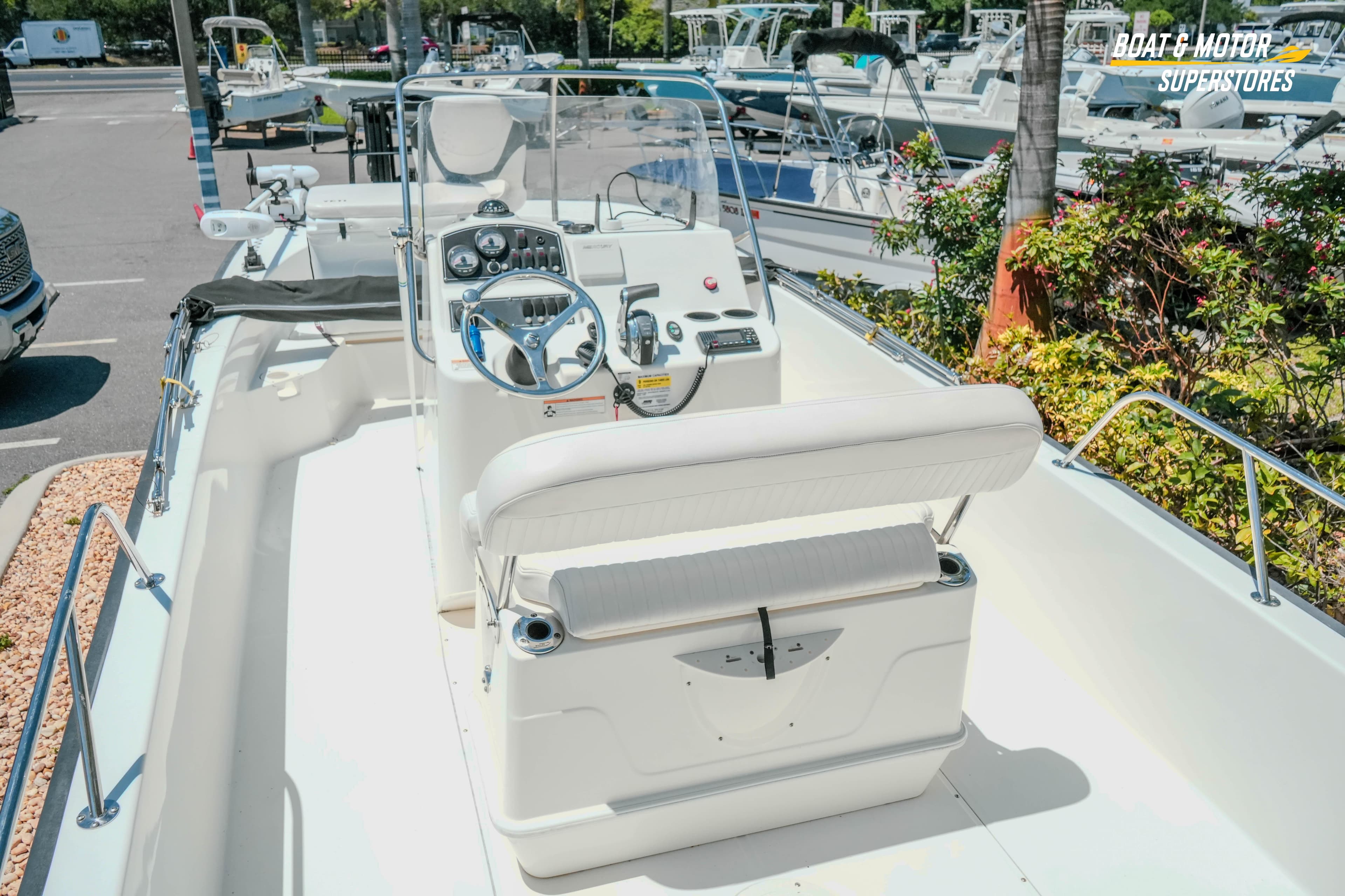 2016 Boston Whaler 210 Montauk boat interior with steering console and seating.