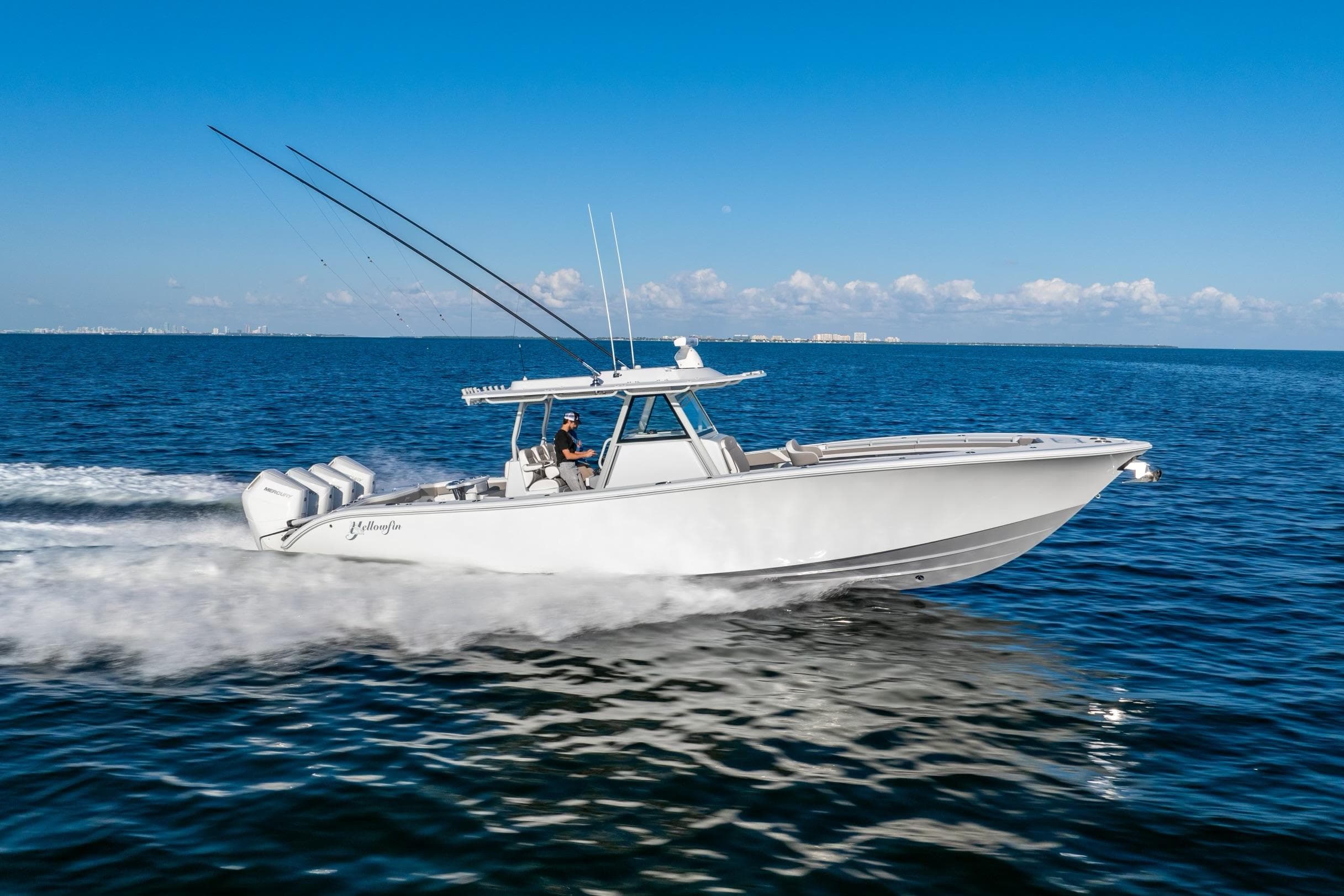 2024 Yellowfin 39 boat cruising on open water under clear blue sky.