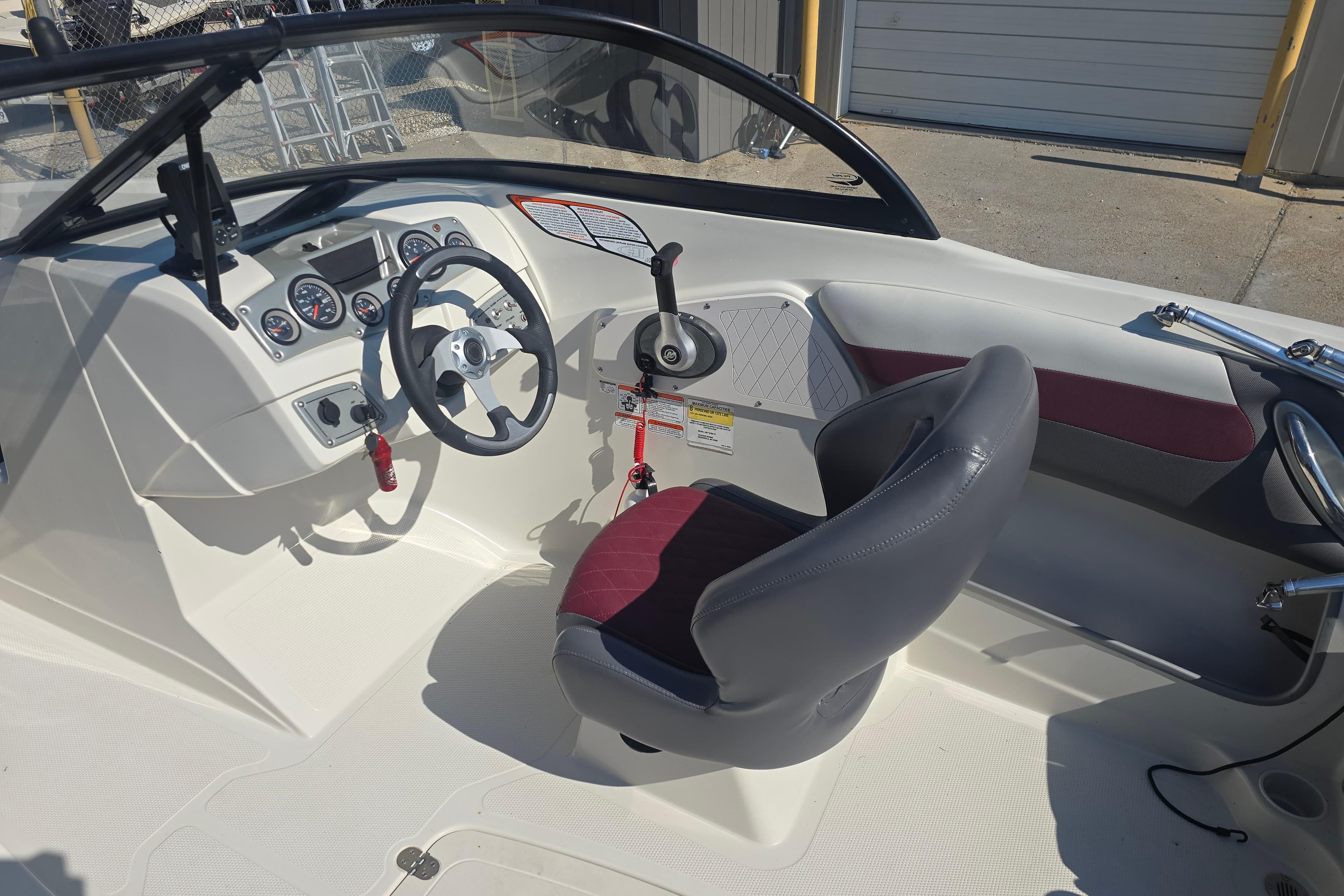 2016 Tahoe 500 TS boat interior with steering wheel and dashboard controls.