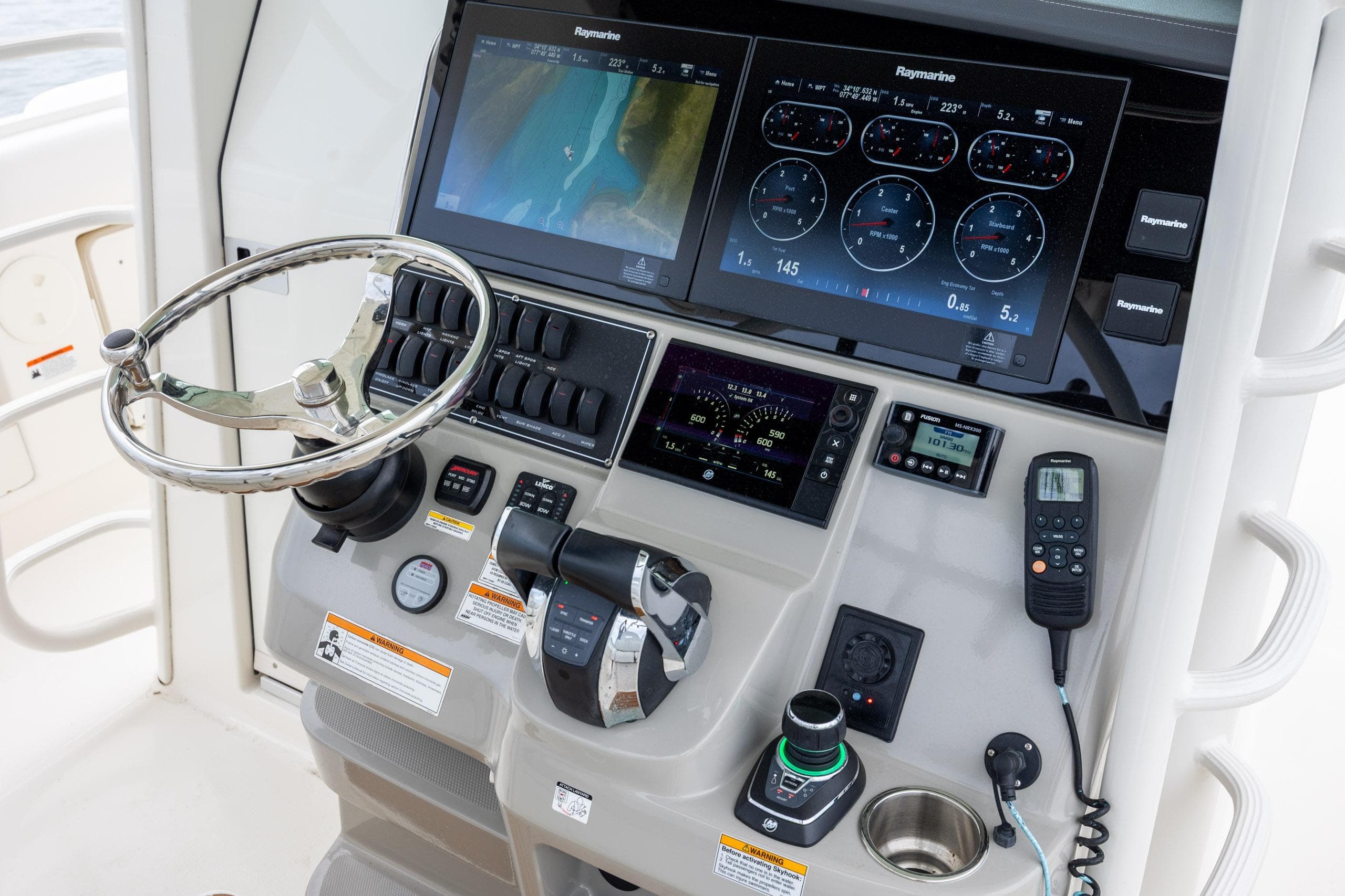 Control panel of a 2017 Boston Whaler 370 Outrage with advanced navigation systems.