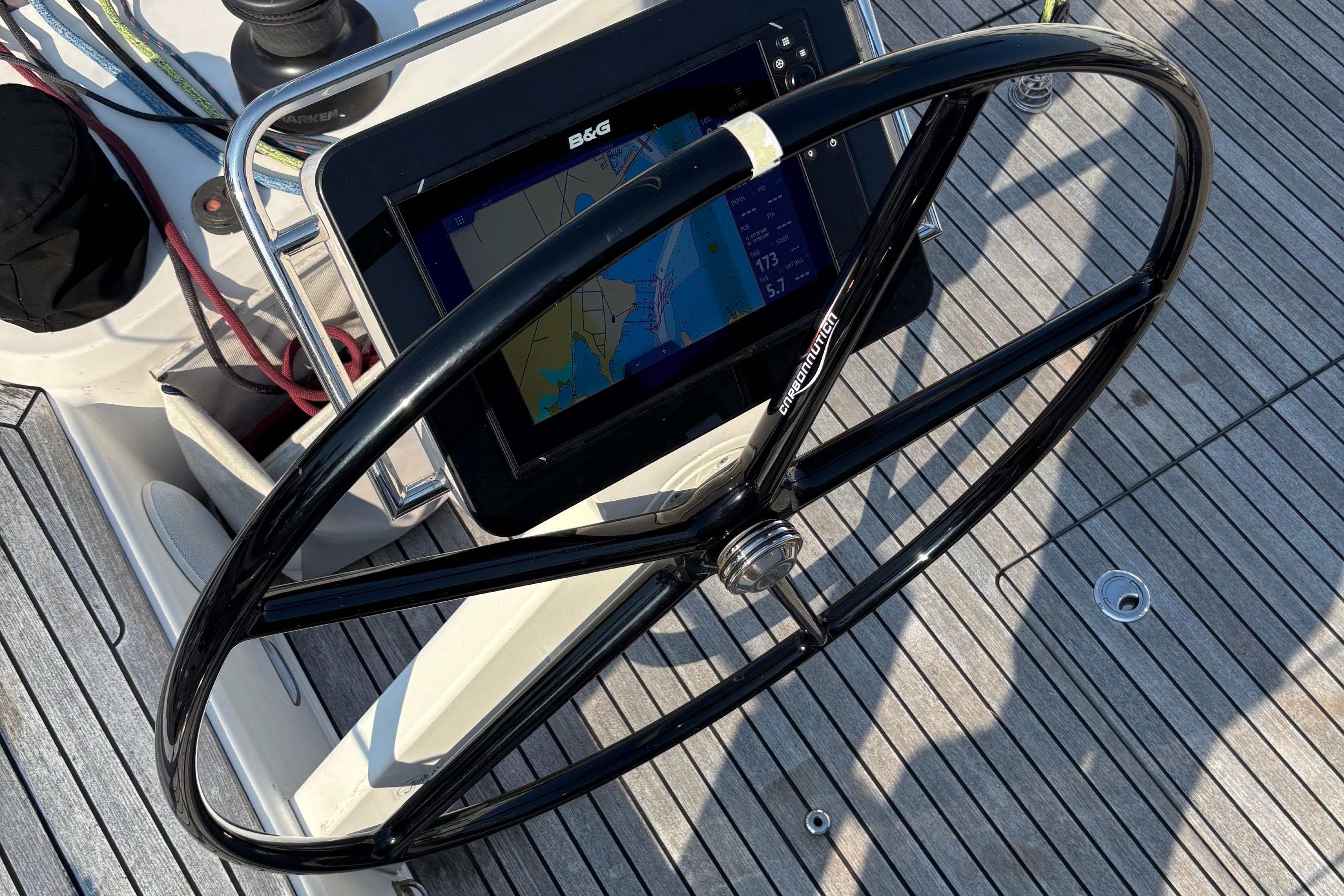 Steering wheel and navigation system on 2018 X-Yachts X4.9 sailboat deck.