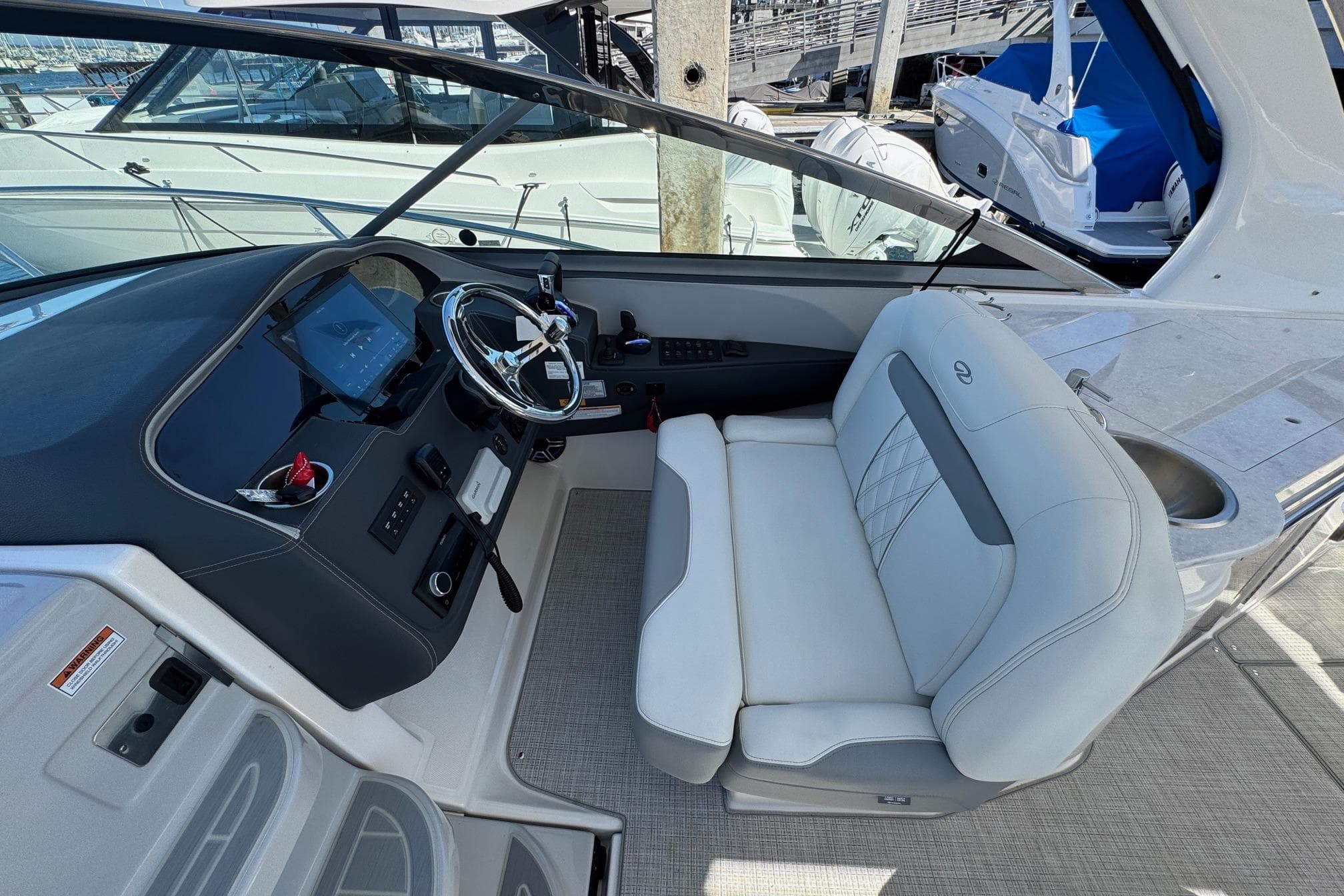 2026 Regal 33 XO boat interior with modern helm and luxurious seating.