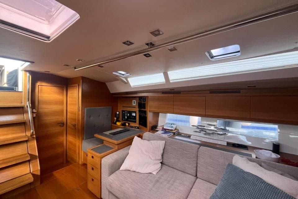 Luxurious interior of 2014 Salona Ker 63 yacht with modern wood finish and comfortable seating.