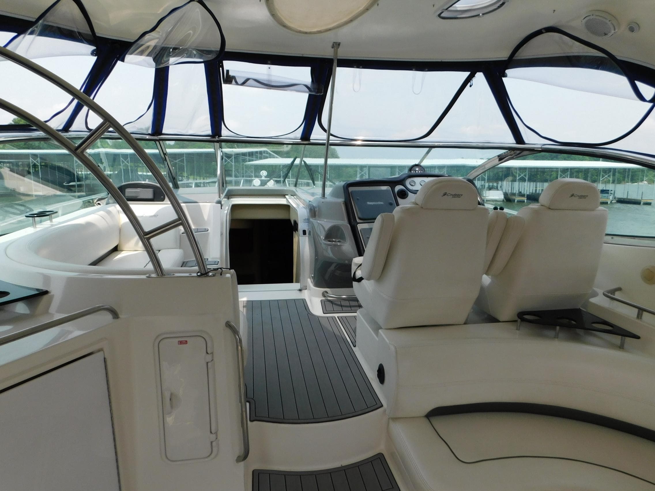 2005 Cruisers Yachts 500 Express cockpit with modern helm, seating, and panoramic windows.