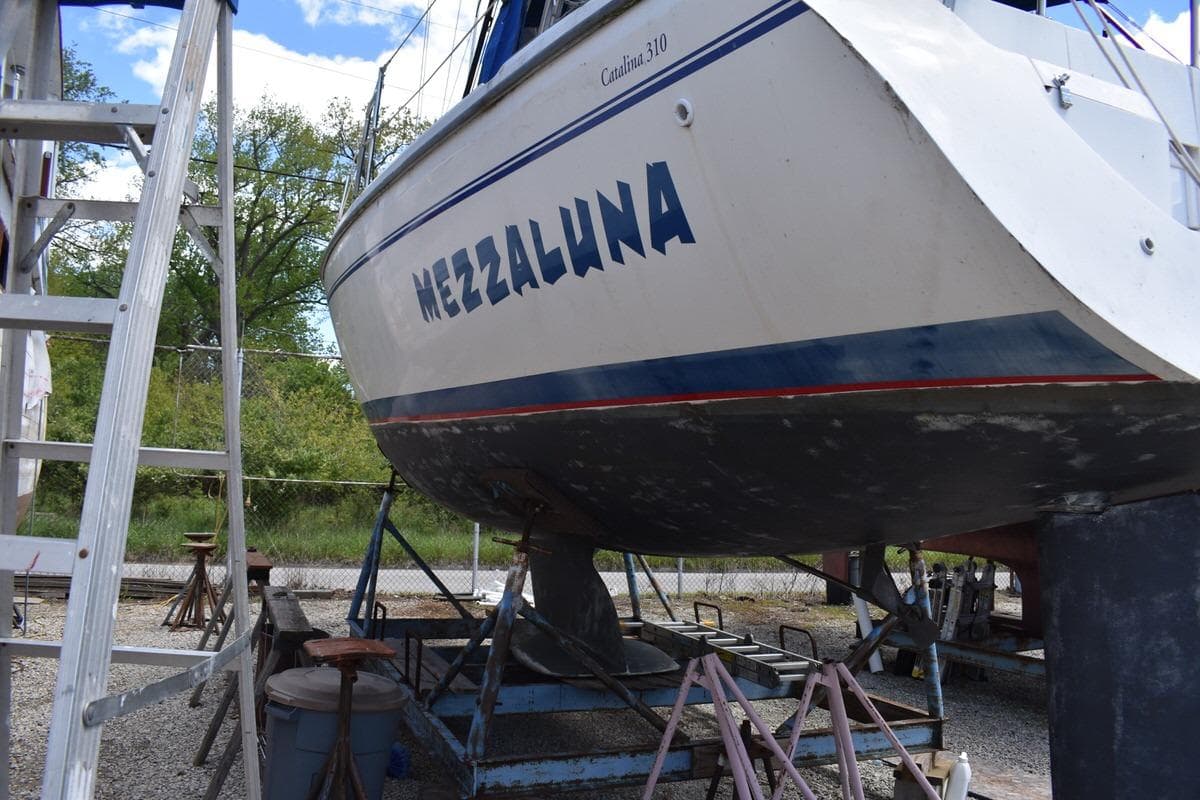 Catalina 310 sailboat named Mezzaluna on dry dock, 2001 model.
