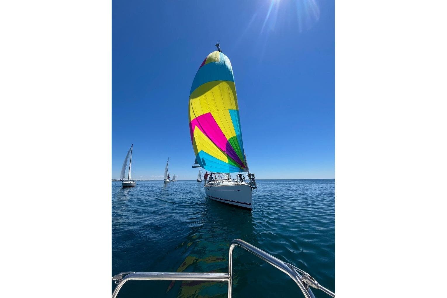 Jeanneau Sun Odyssey 45 sailing with colorful spinnaker on a clear day, 2008 model.
