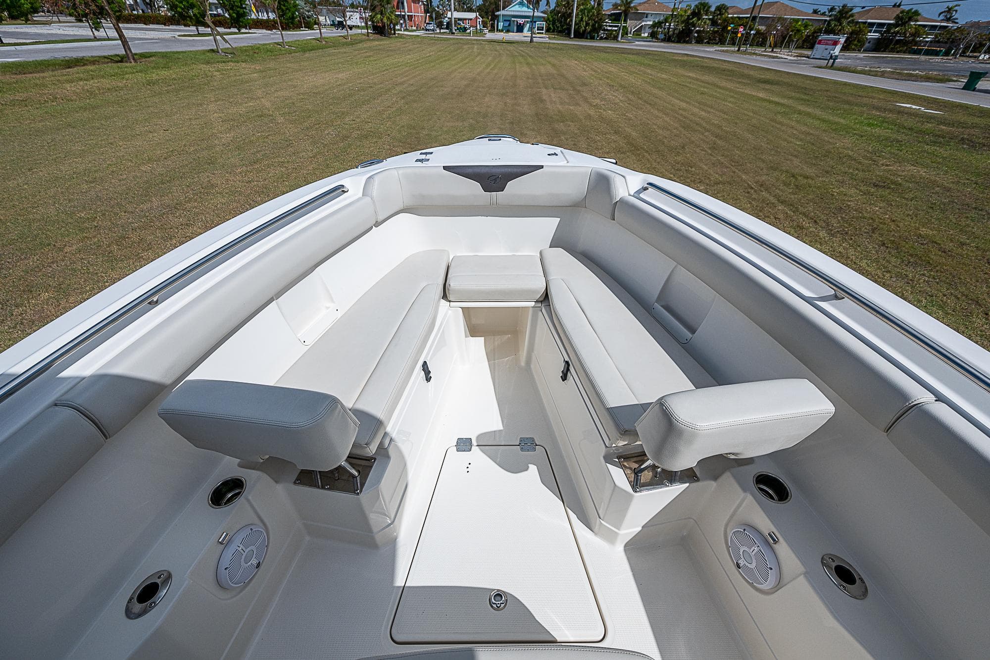 2022 Sailfish 272CC boat interior with white seating and spacious layout.
