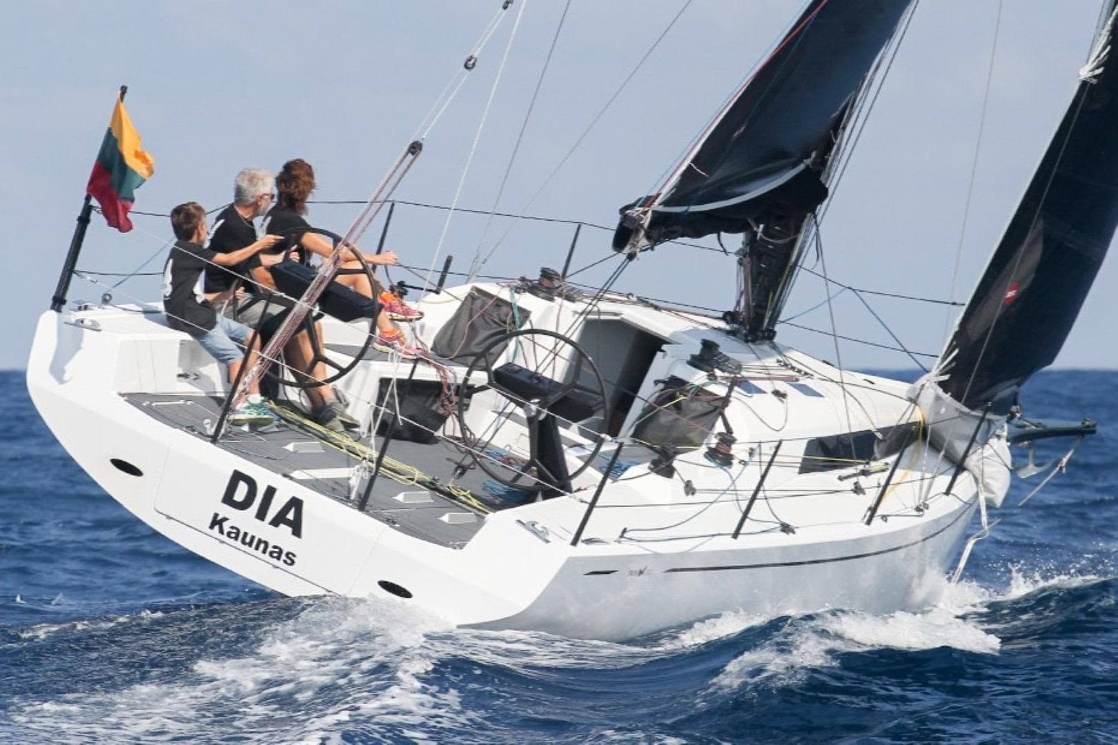 Sailing yacht Neo 350, 2018 model, navigating ocean waves with crew onboard.
