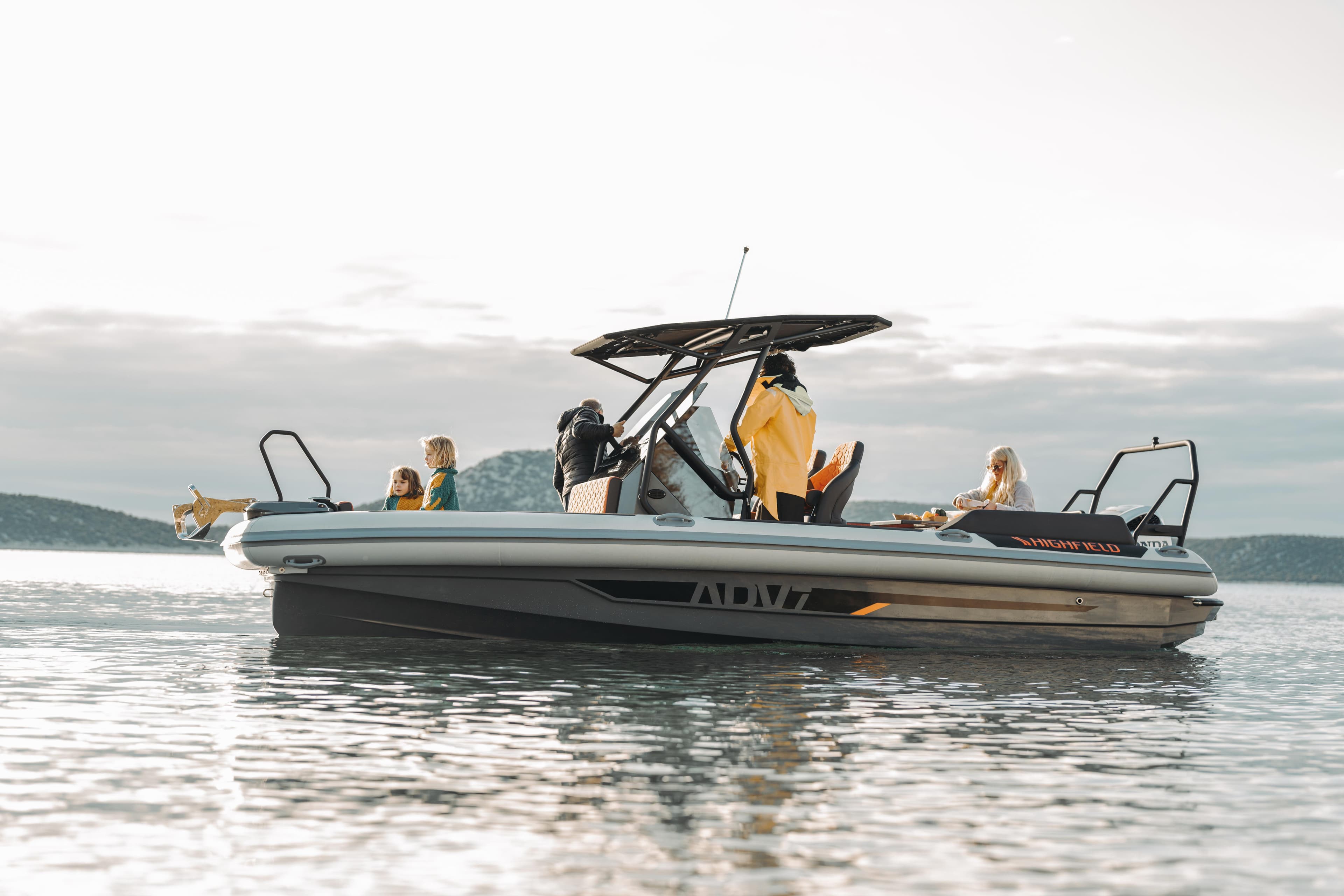 2026 Highfield ADV7 boat on calm water with passengers enjoying the ride.