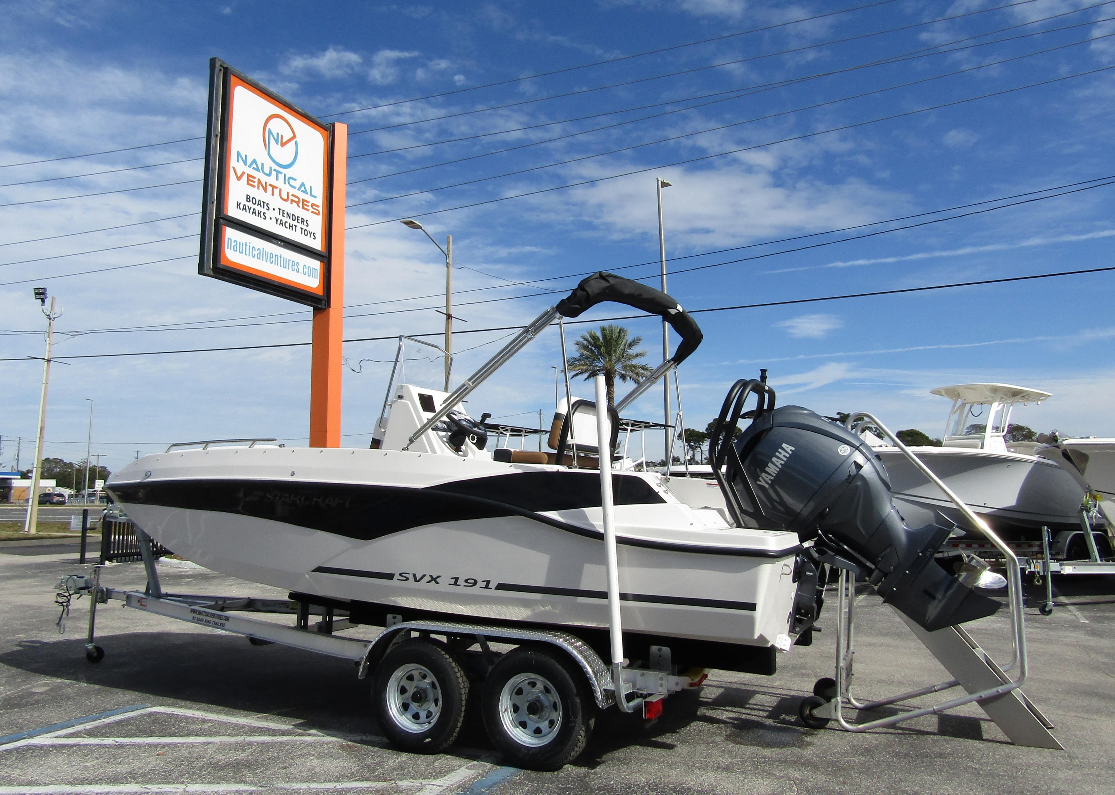2024 Starcraft SVX 191 OB CC boat on trailer at Nautical Ventures dealership.