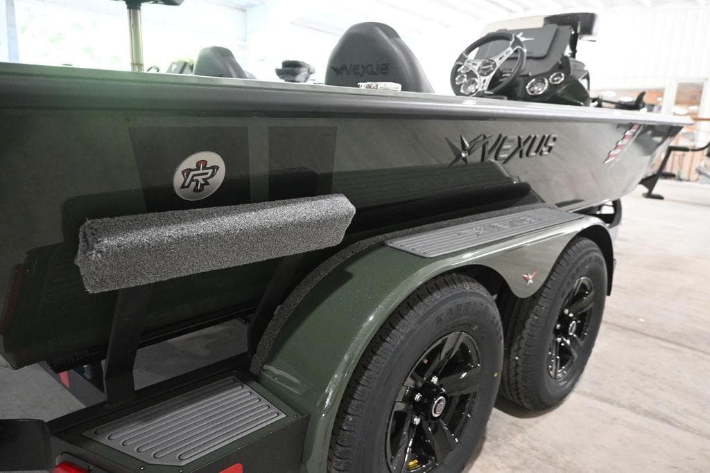 2026 Vexus AVX 1980 boat on trailer, featuring sleek design and dual wheels.