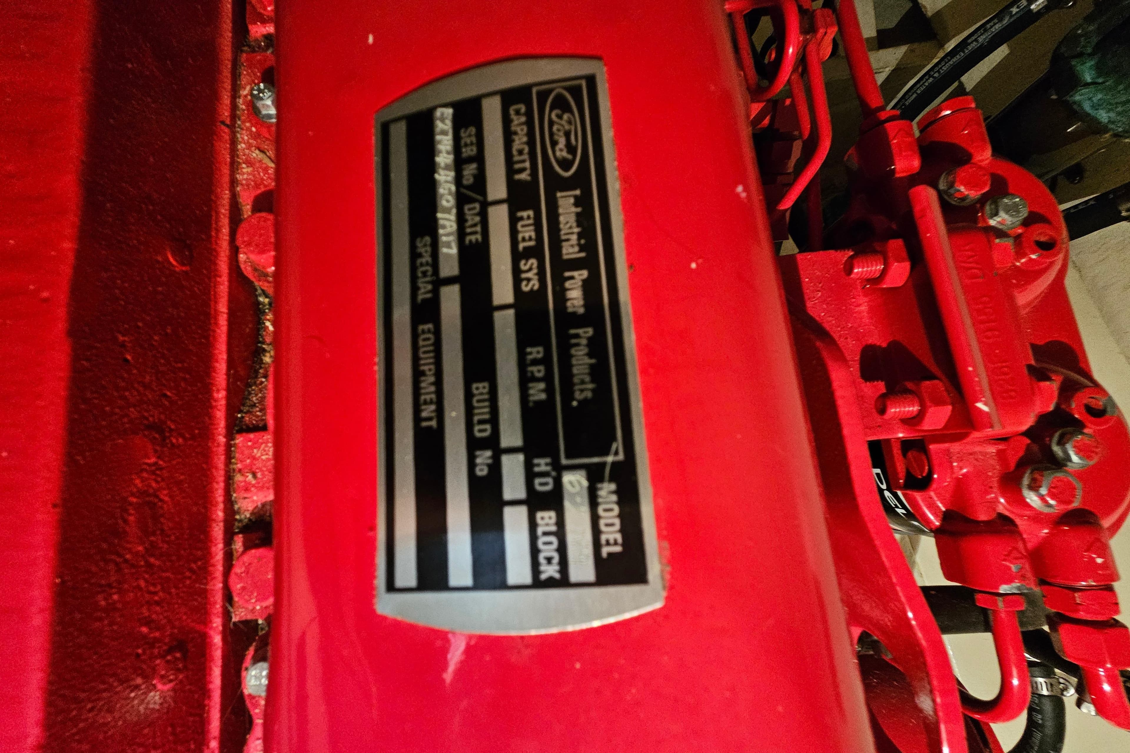 Red engine with Ford Industrial Power Products label, CHB 34 model, 1978.