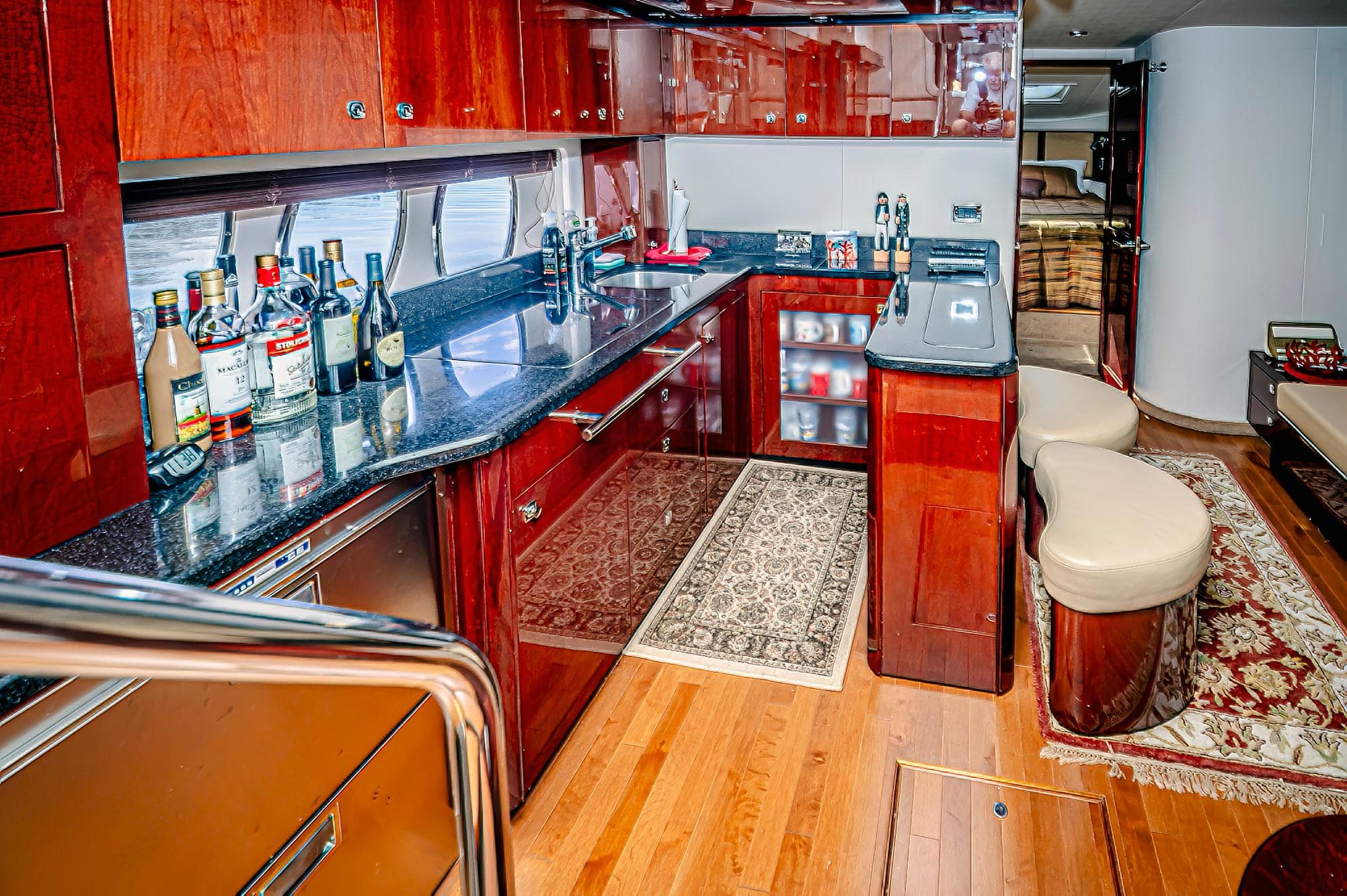 Luxurious 2011 Sea Ray 580 Sundancer yacht interior with elegant kitchen and bar area.