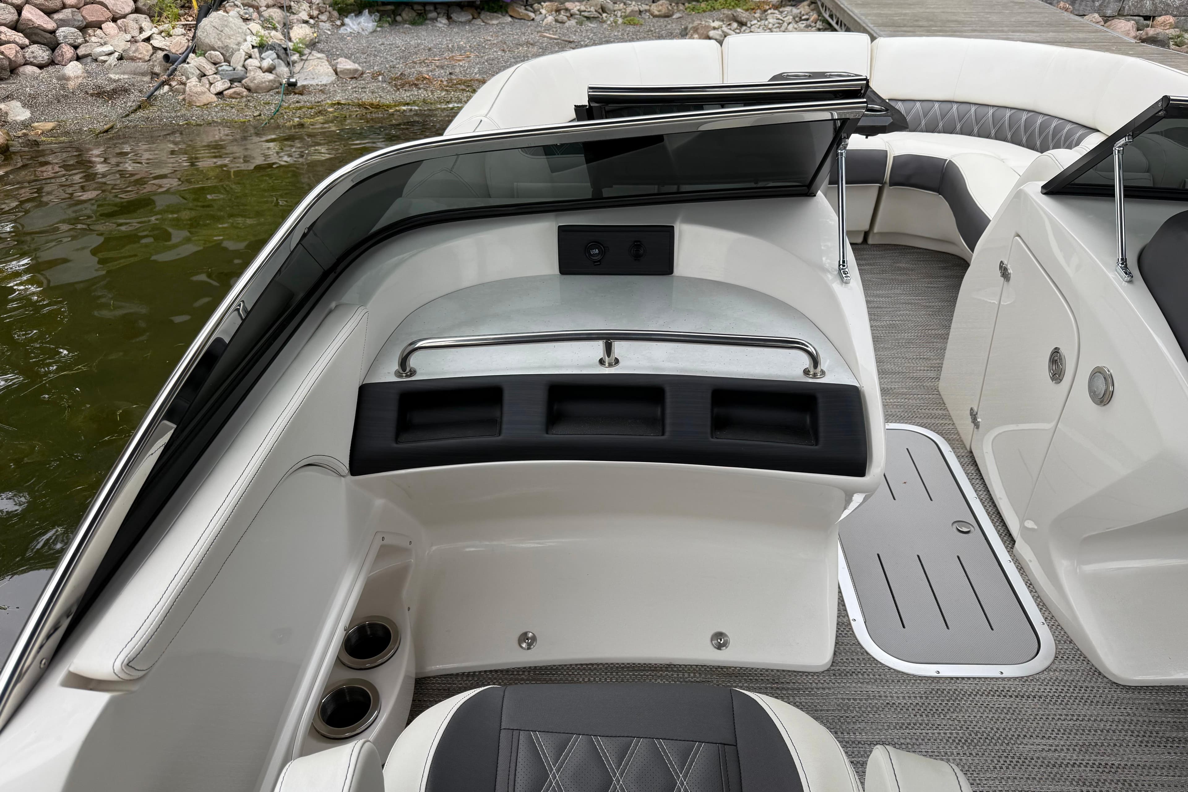 2021 Bennington R 23 Swingback boat interior with seating and storage compartments.