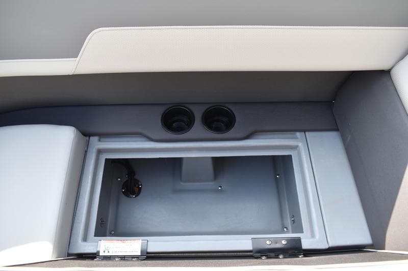 Interior storage compartment of 2026 Lowe LS 170 boat with cup holders.