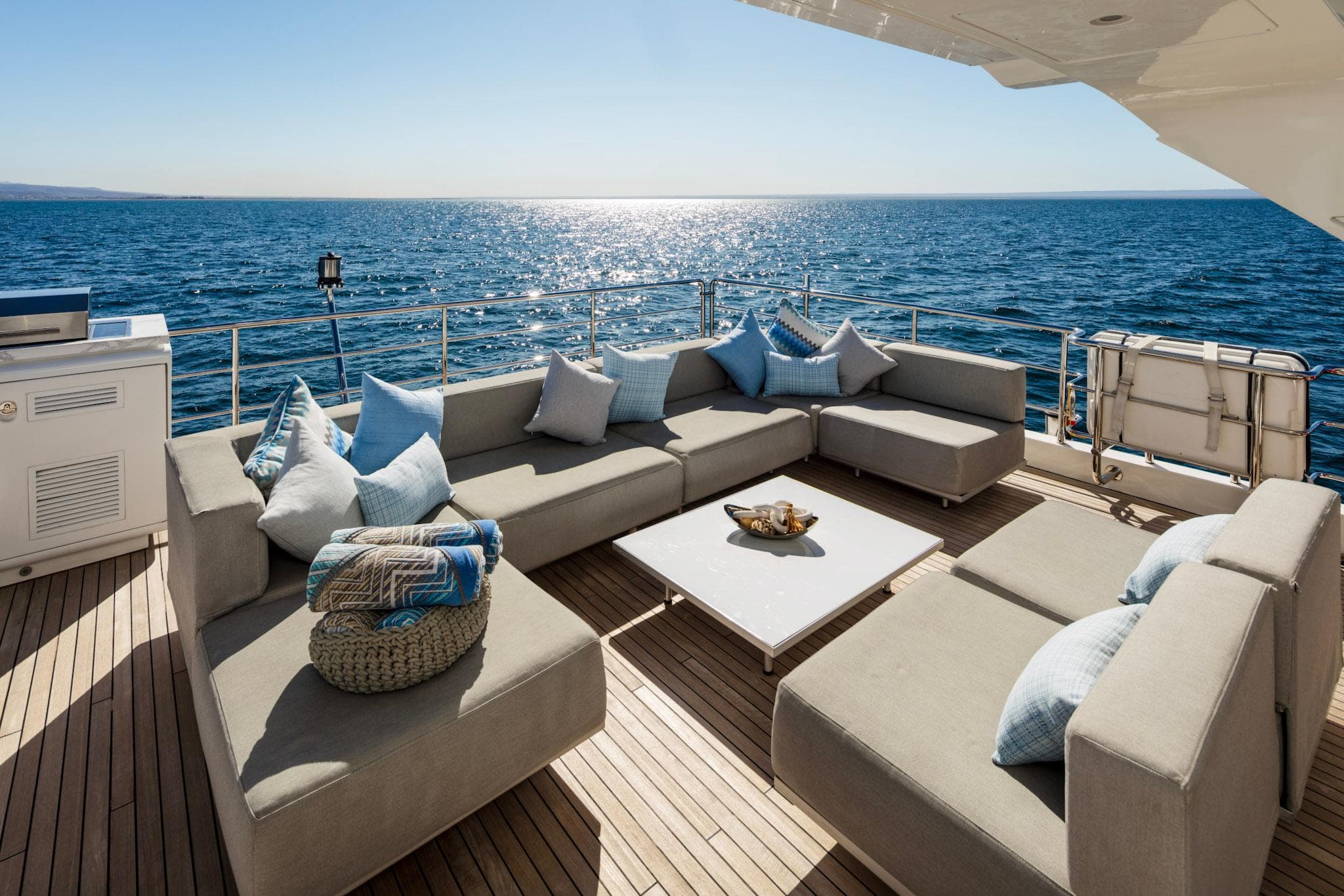 Luxurious Azimut Grande 30 Metri yacht deck with elegant seating, ocean view, 2017 model.