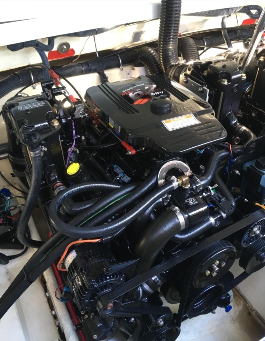 Engine of 2005 Formula 330 Sun Sport boat, showcasing intricate mechanical components.