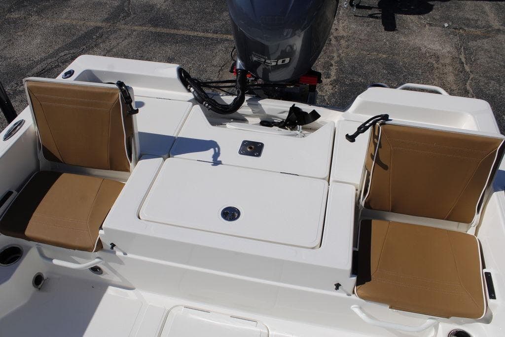 2026 Skeeter SX230 boat with tan seats and outboard motor.