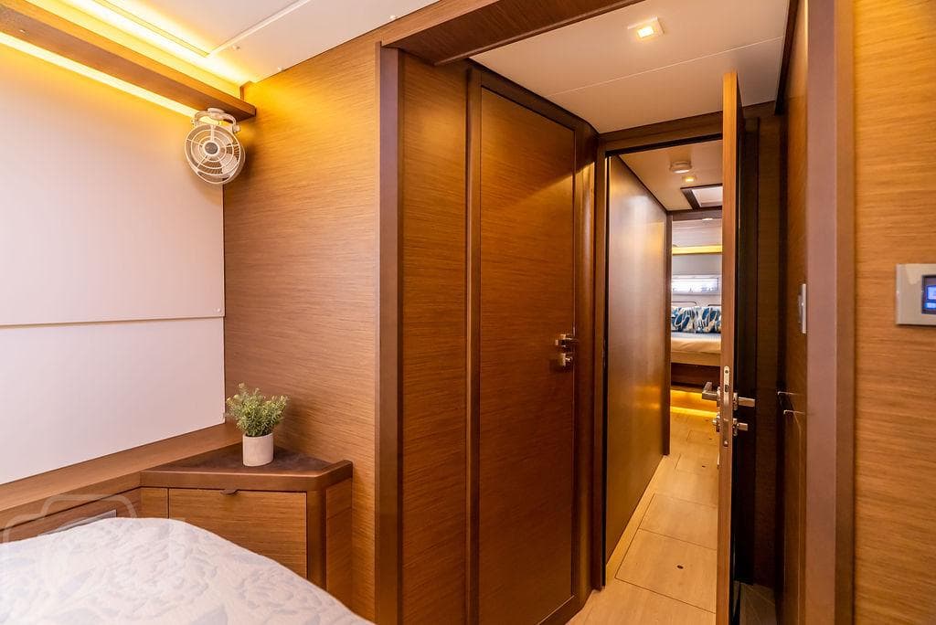 Luxurious interior of 2021 Lagoon 46 yacht, featuring wood paneling and modern design.