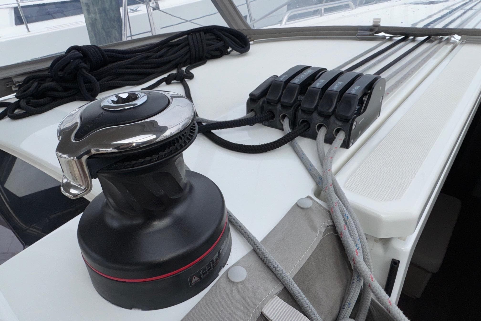 Winch and rope clutches on 2022 Beneteau Oceanis 40.1 sailboat deck.
