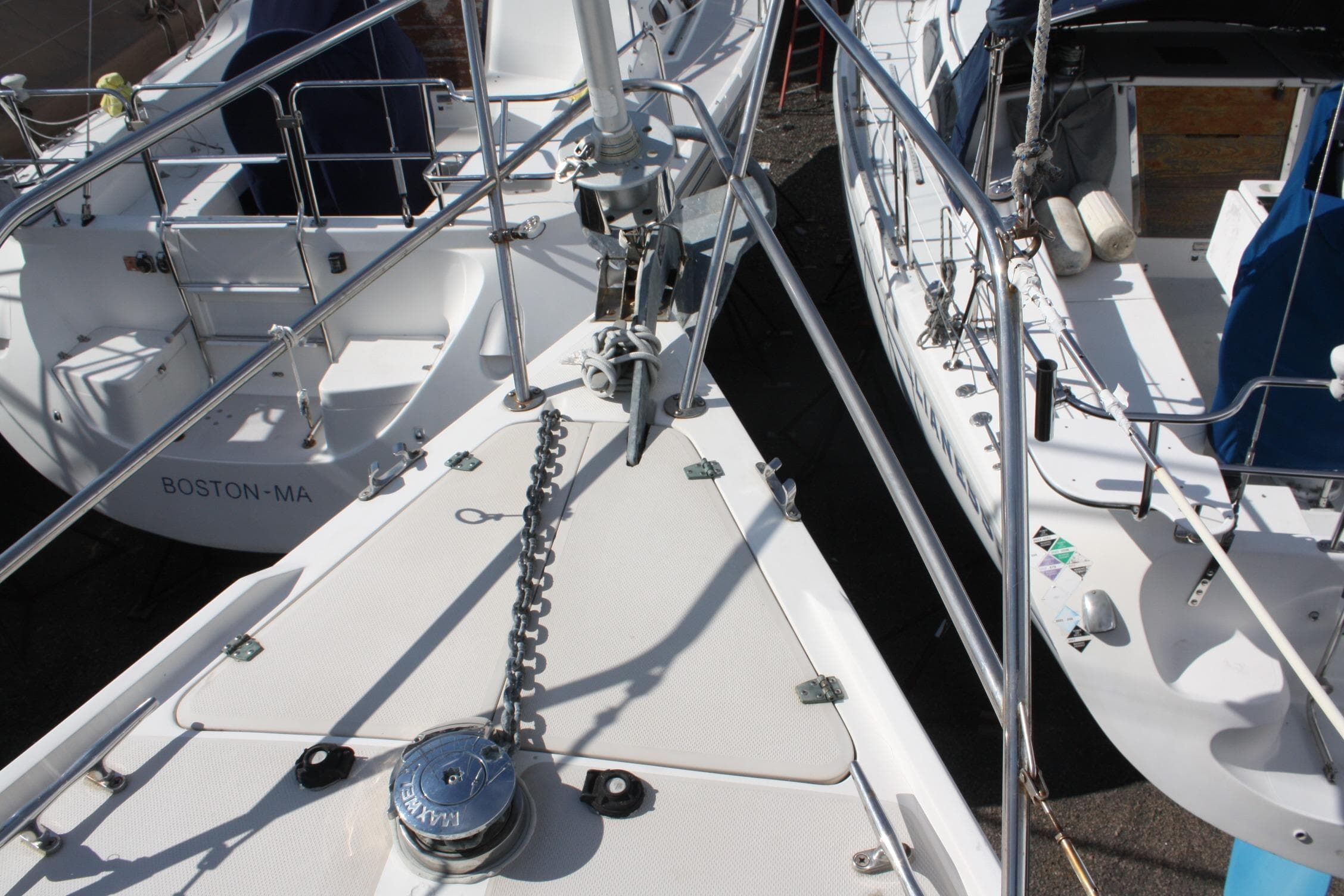Bow of 1986 Catalina 36 sailboat with anchor chain and deck details.