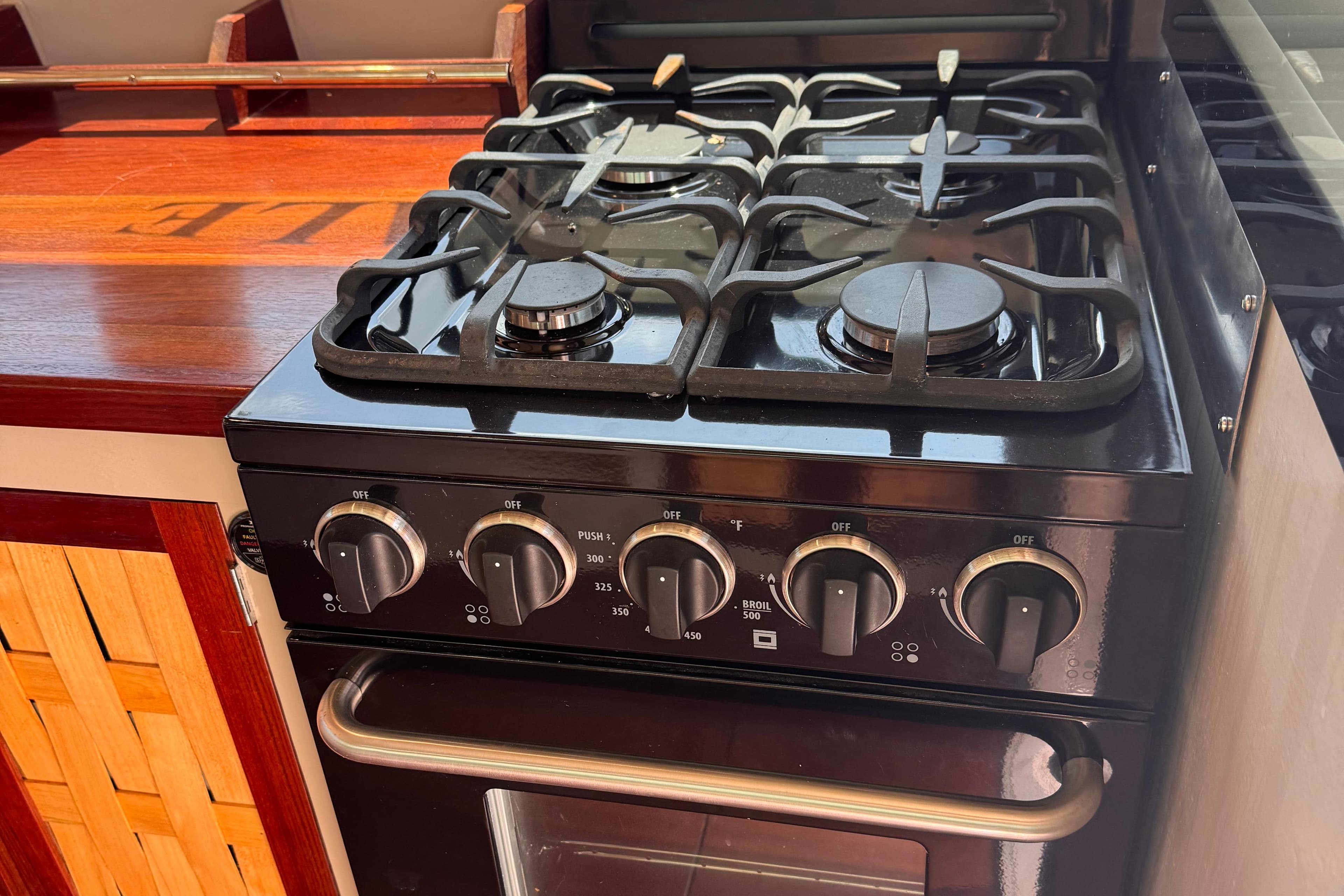 Gas stove and oven in 2021 Cape Island Cruisers Cape Sable trawler kitchen.