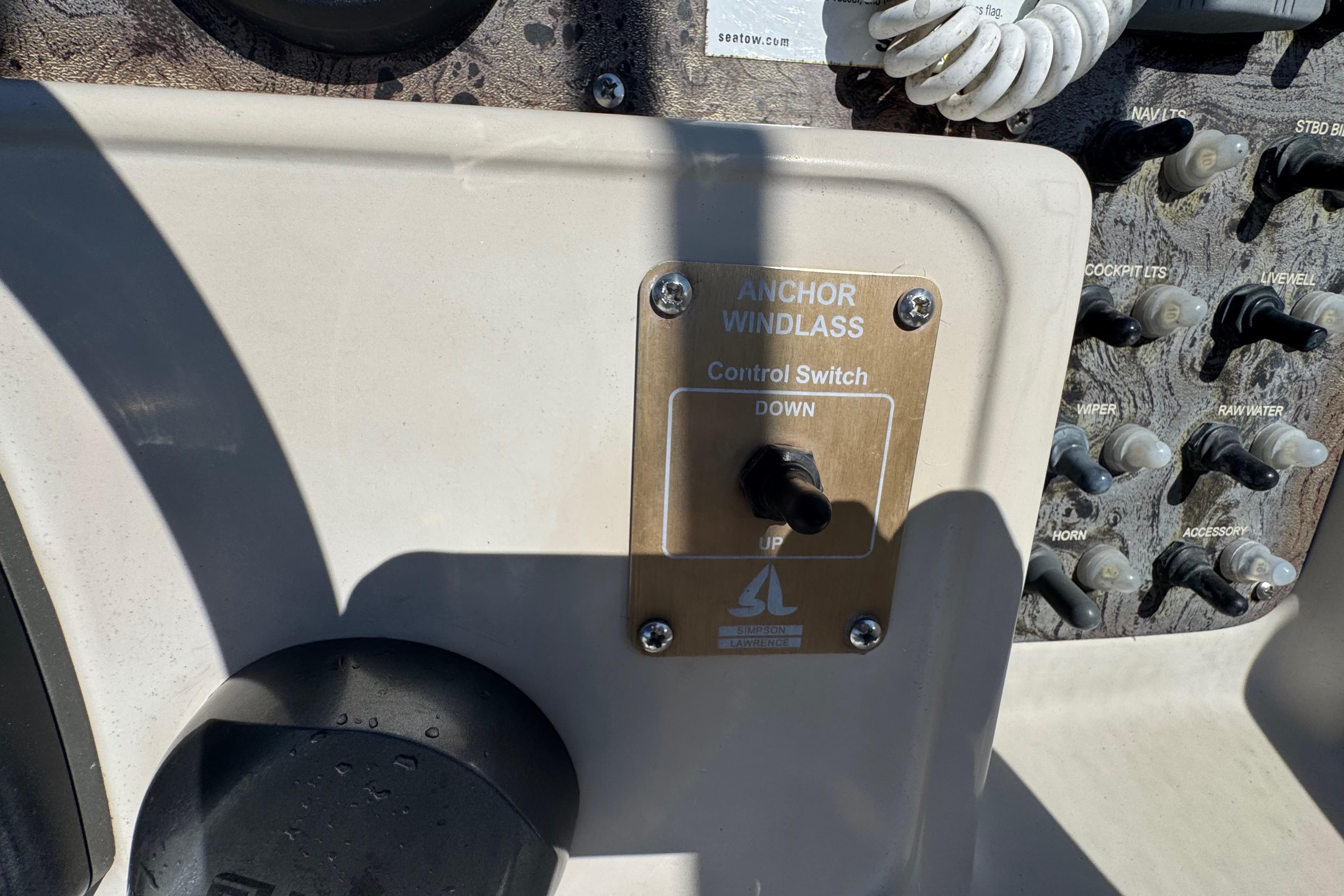 Control panel of a 2000 World Cat 246 DC boat with anchor windlass switch.
