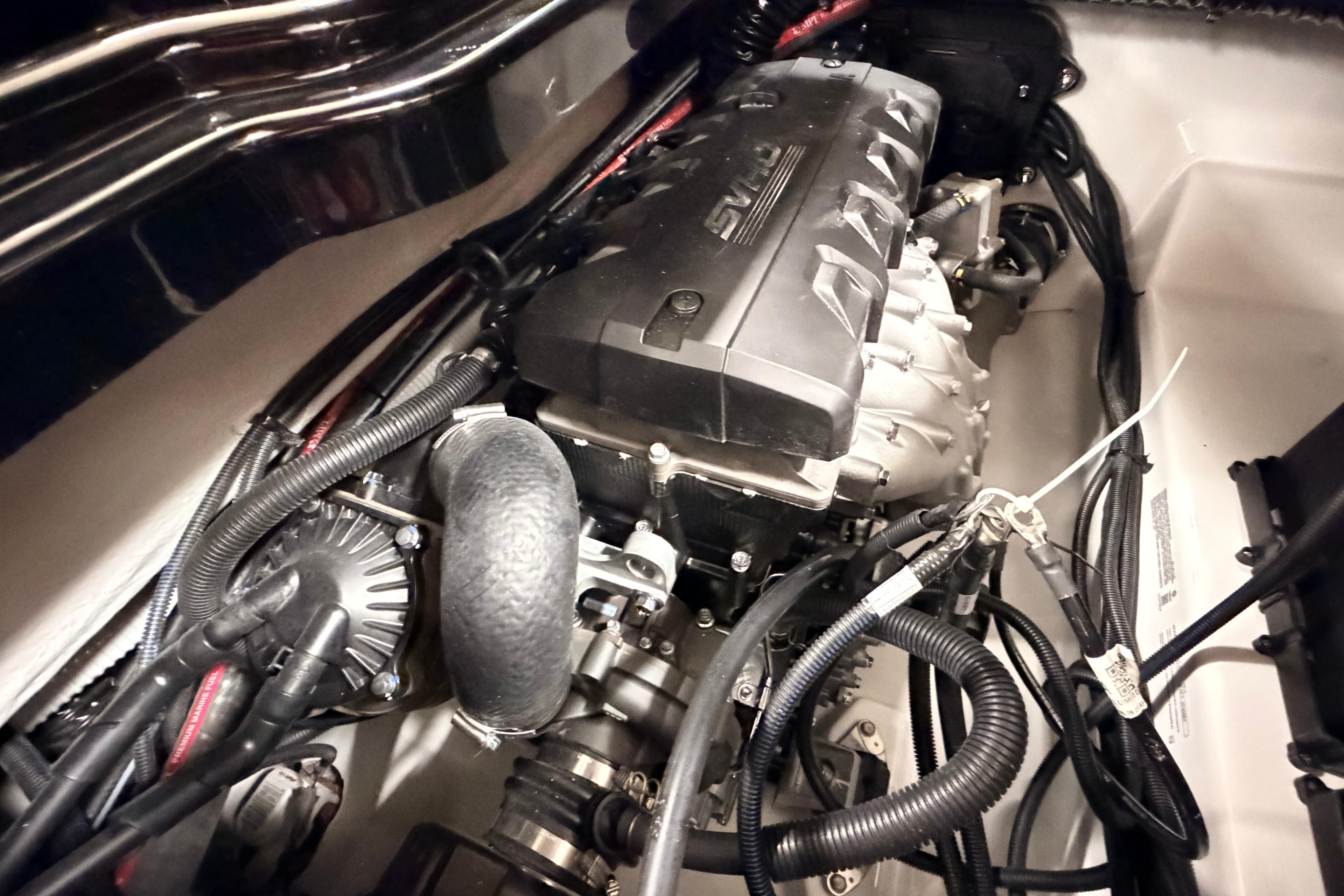 2026 Yamaha Boats 275SD engine compartment with visible components and wiring.