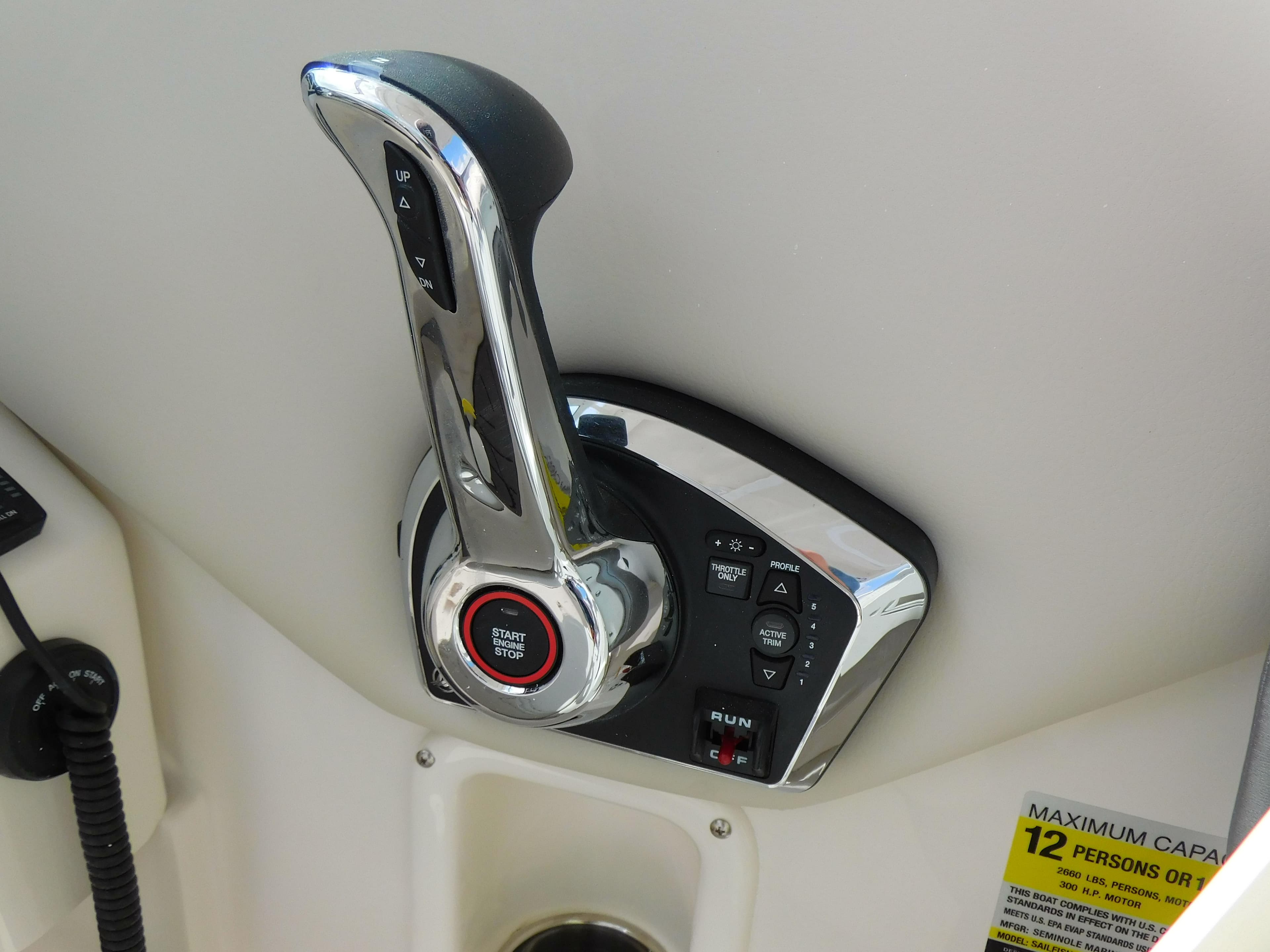 Throttle control of 2025 Sailfish 245 DC boat, featuring a sleek chrome finish.